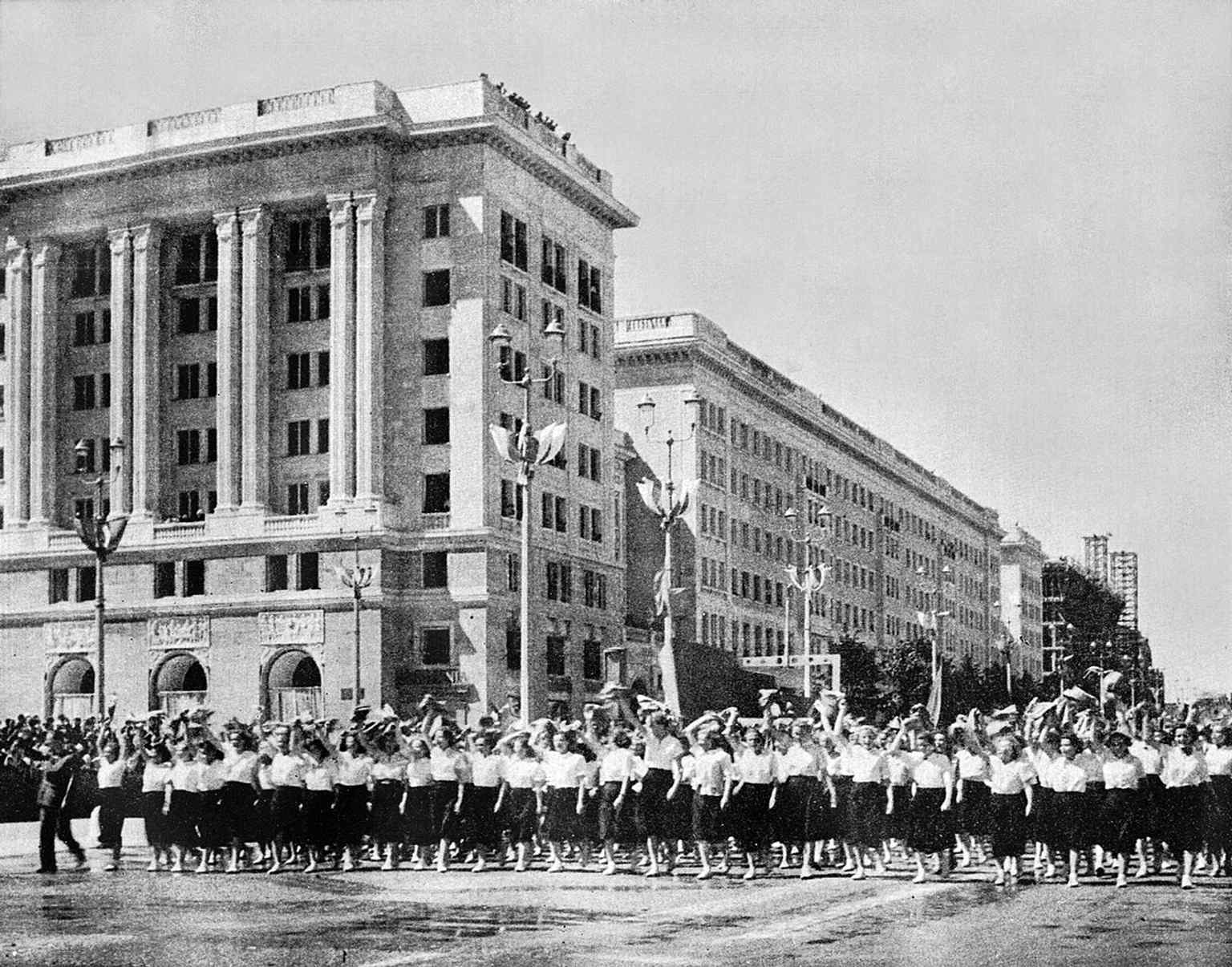 Youth marching on 22 July 1952, echoing the political theater that marked Constitution Square’s opening day.
