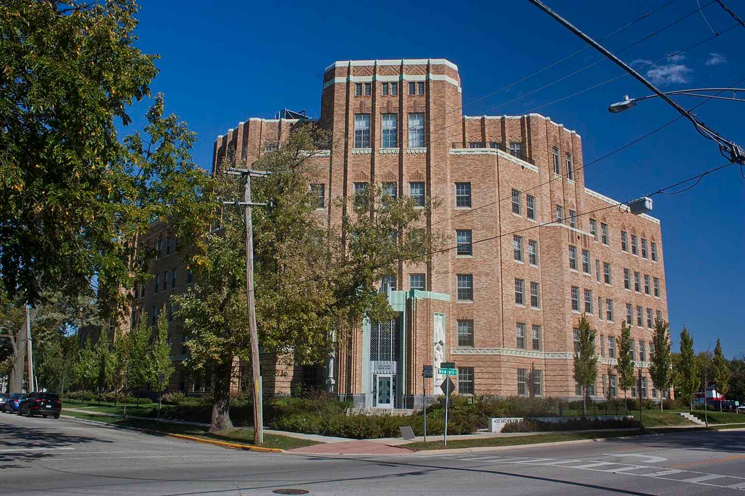 Front view of the former St. Charles Hospital in Aurora, showing the landmark as it appeared in 2020 after years of use as a nursing facility.