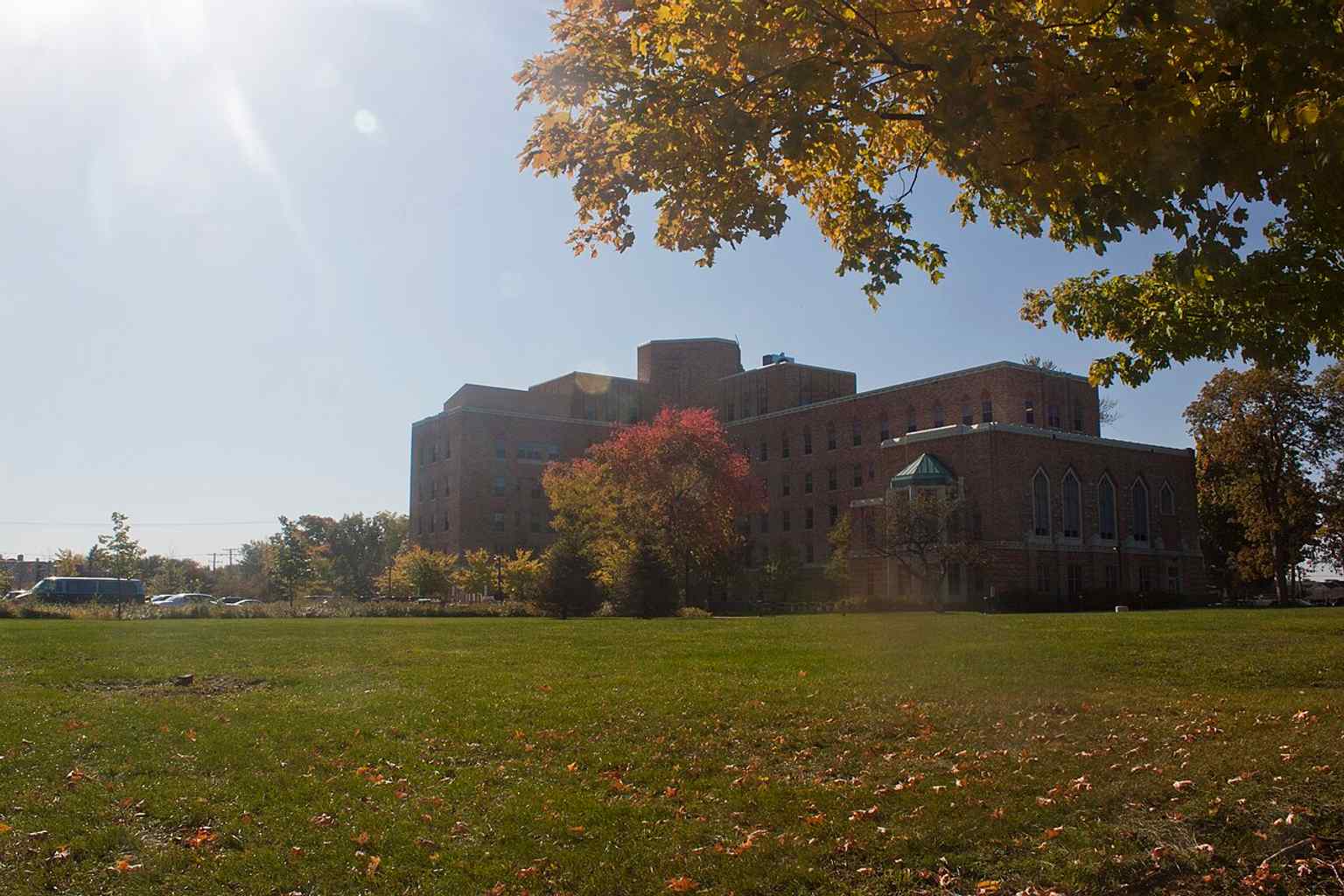 Rear view of the hospital from Spring Street, useful for showing the full scale of the 1932 building and its later vacant state.