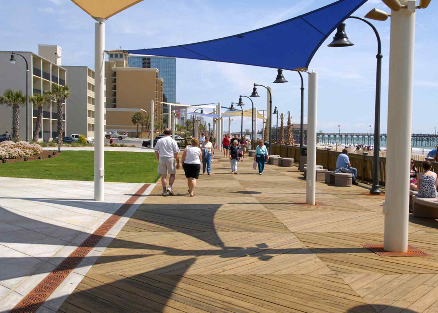 A broad Myrtle Beach beach scene that shows the oceanfront setting where the 1.2-mile boardwalk and promenade runs along the shoreline.