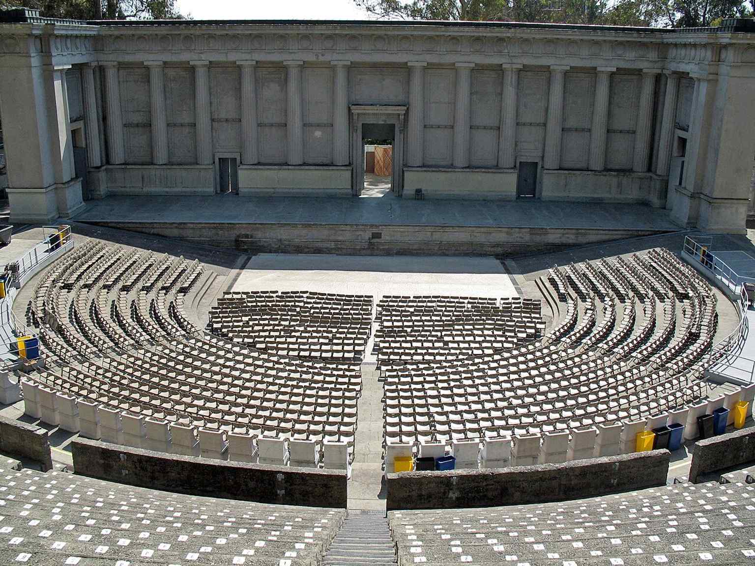 A clean modern view of the open-air Greek Theatre bowl, the 8,500-seat venue that rises from Berkeley’s hillside amphitheater.