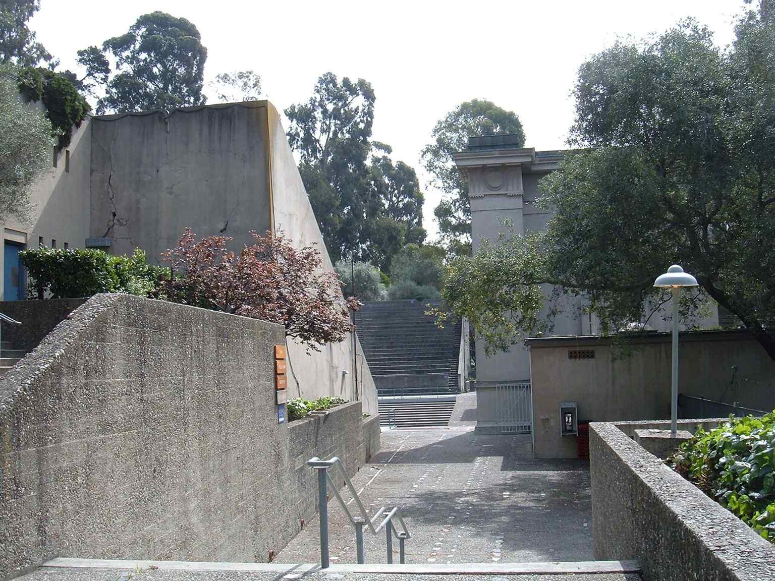 The west entrance and classical façade show the Doric-columned stage side of the theatre, built to echo an ancient Greek amphitheater.