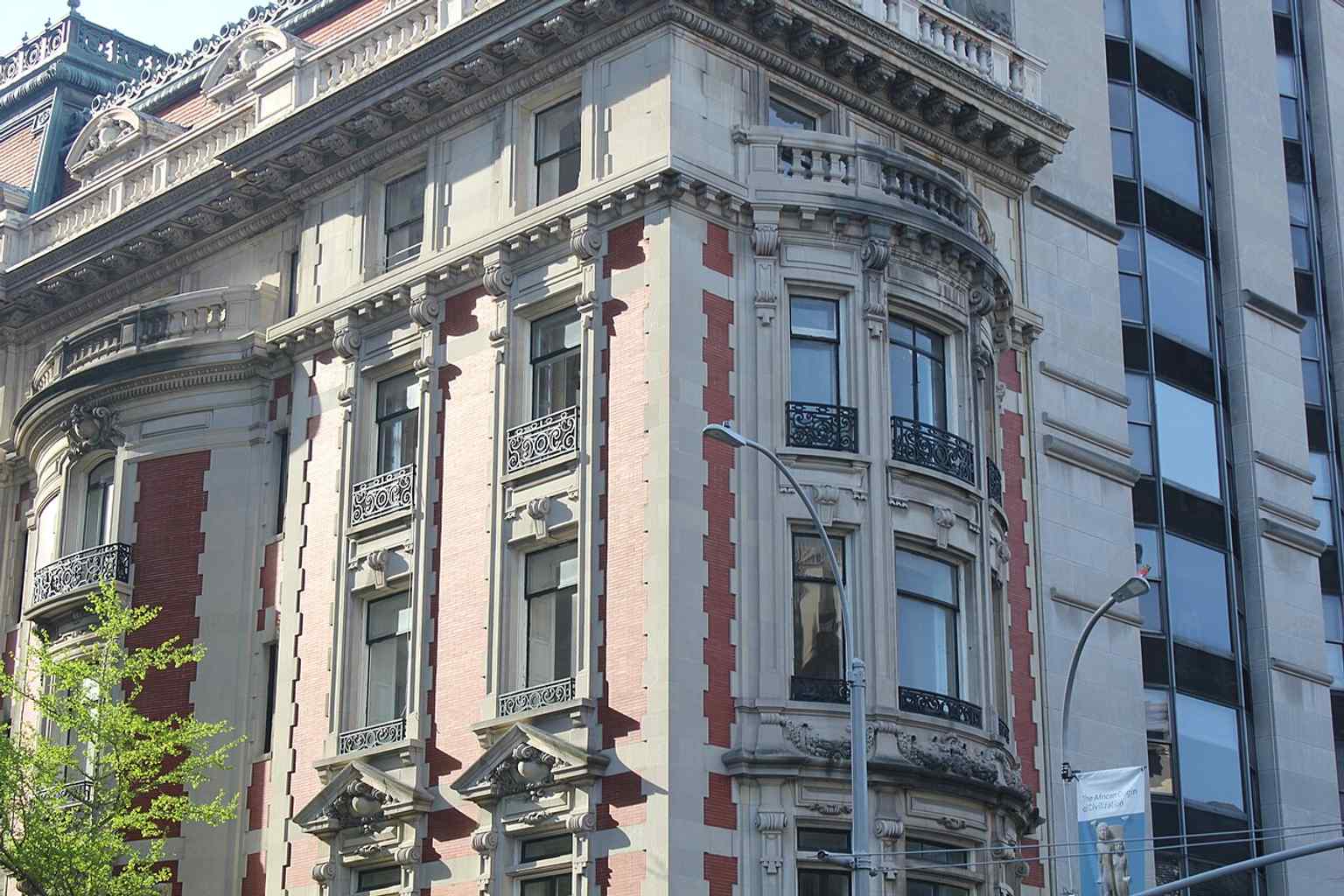 The rusticated limestone blocks of the ground floor and basement provide a robust foundation for the Benjamin N. Duke House, a hallmark of its Beaux-Arts design.