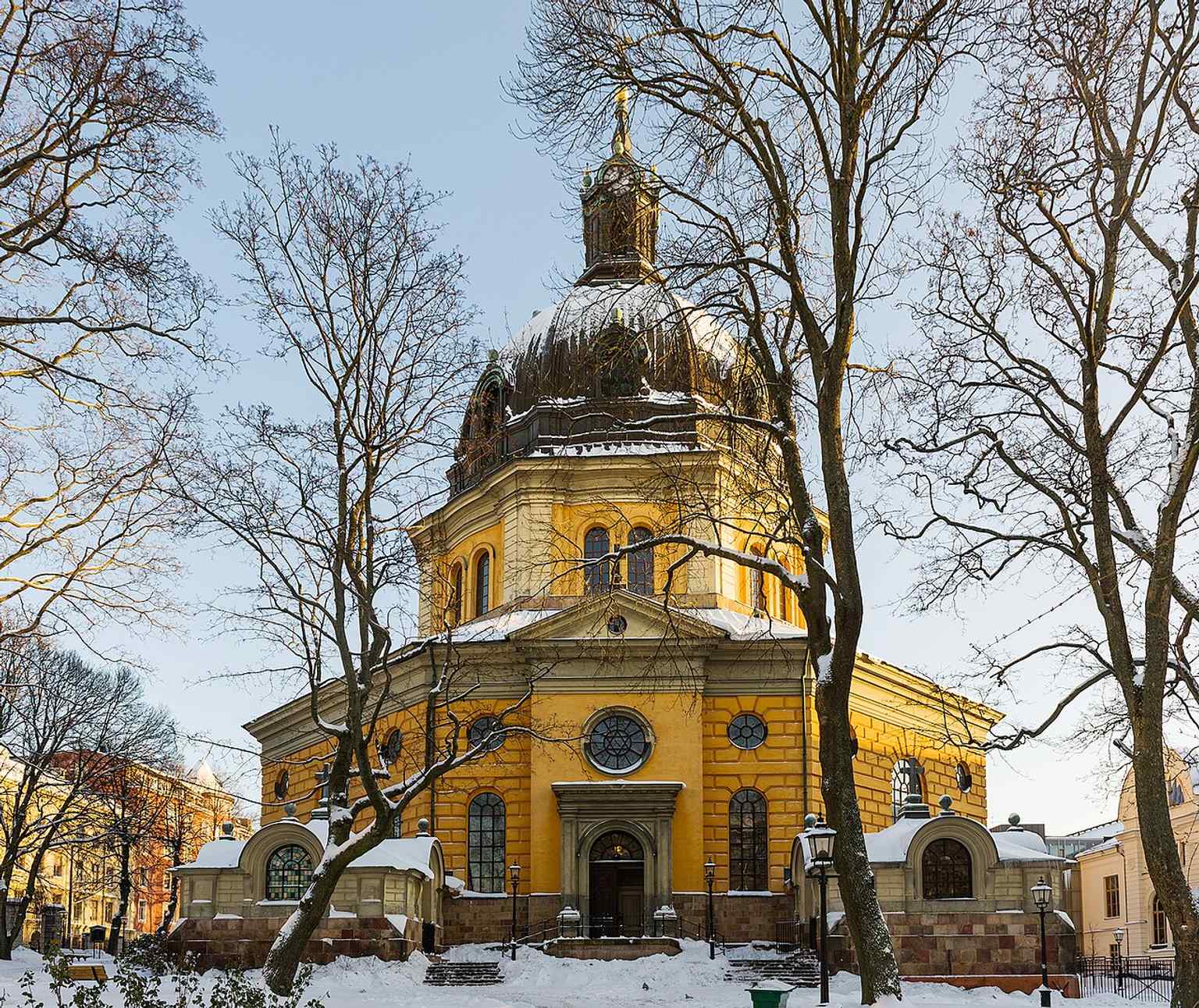 The west end and dome in winter light, highlighting how the 18th-century church body was later crowned with a 19th-century cupola.