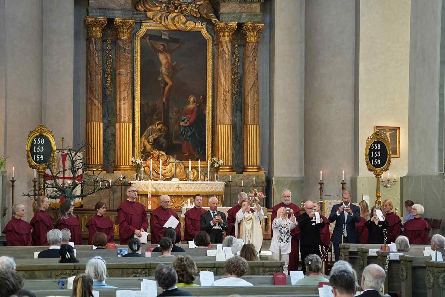 A contemporary worship scene with communion vessels, connecting the church’s historic interior to living parish life.