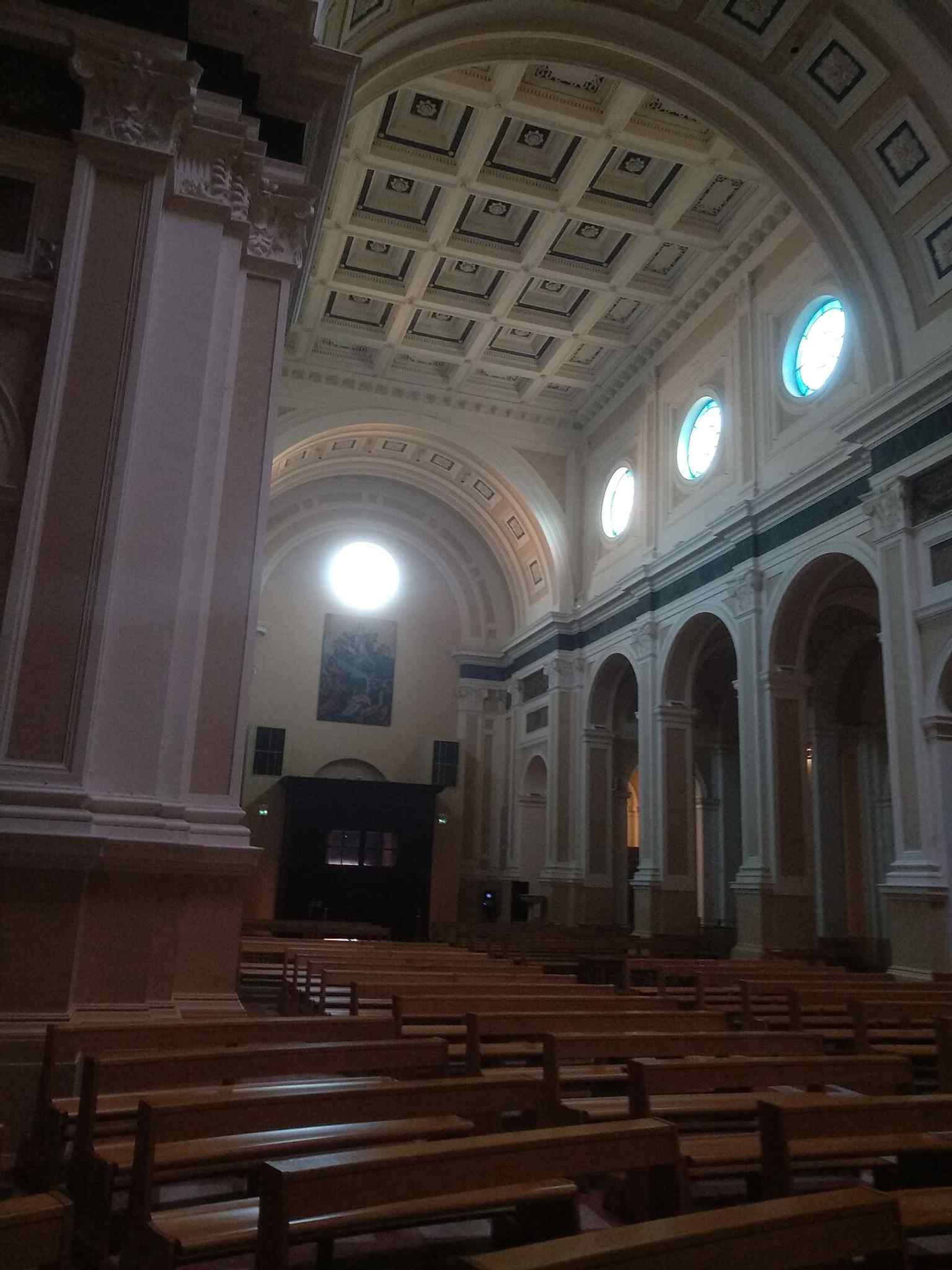The Romanesque brick façade of Pesaro’s cathedral, a strong first view of the church before later Baroque and Neoclassical changes inside.