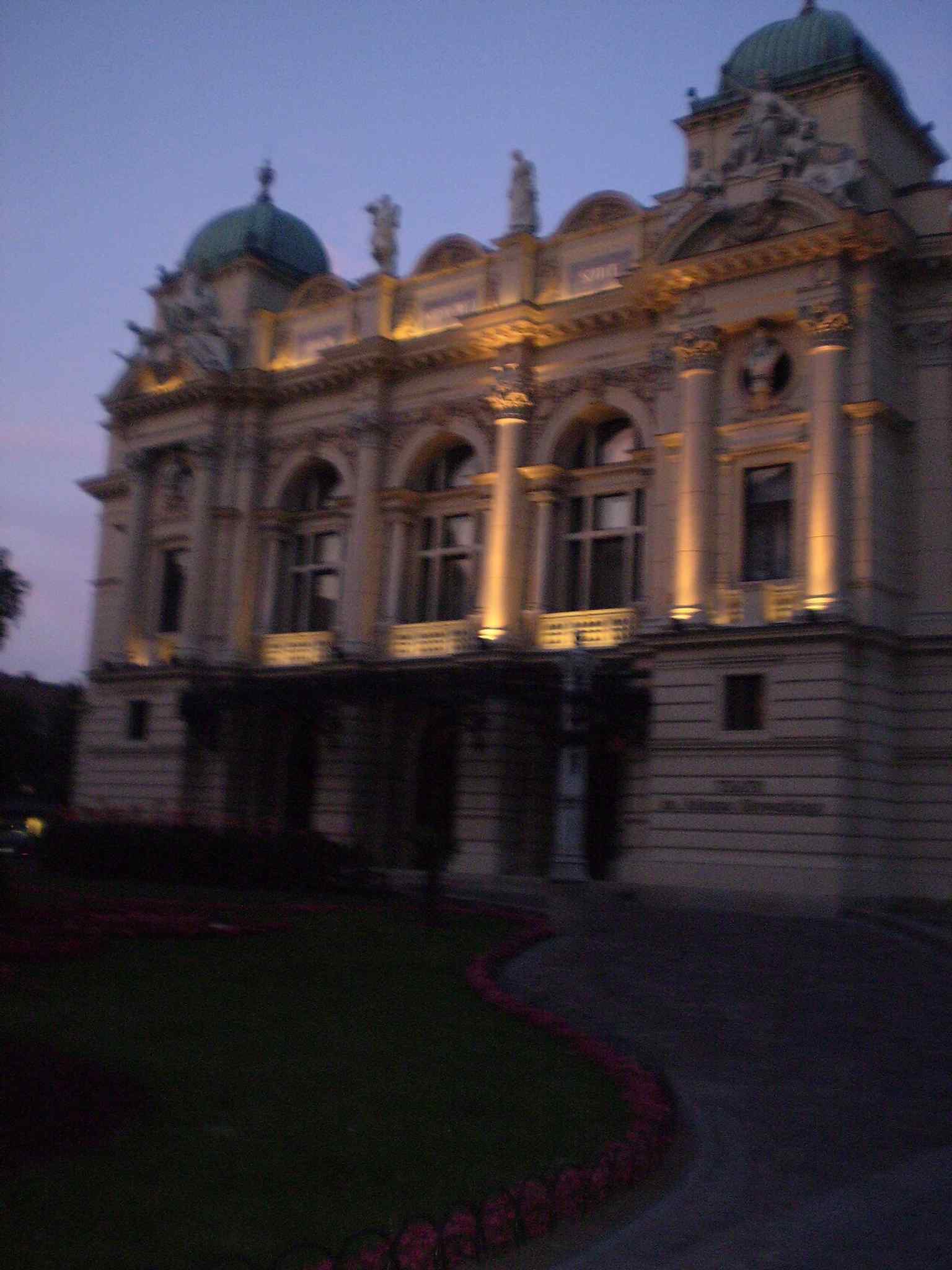 The theatre at night, showing how the historic façade becomes a dramatic landmark after dark.