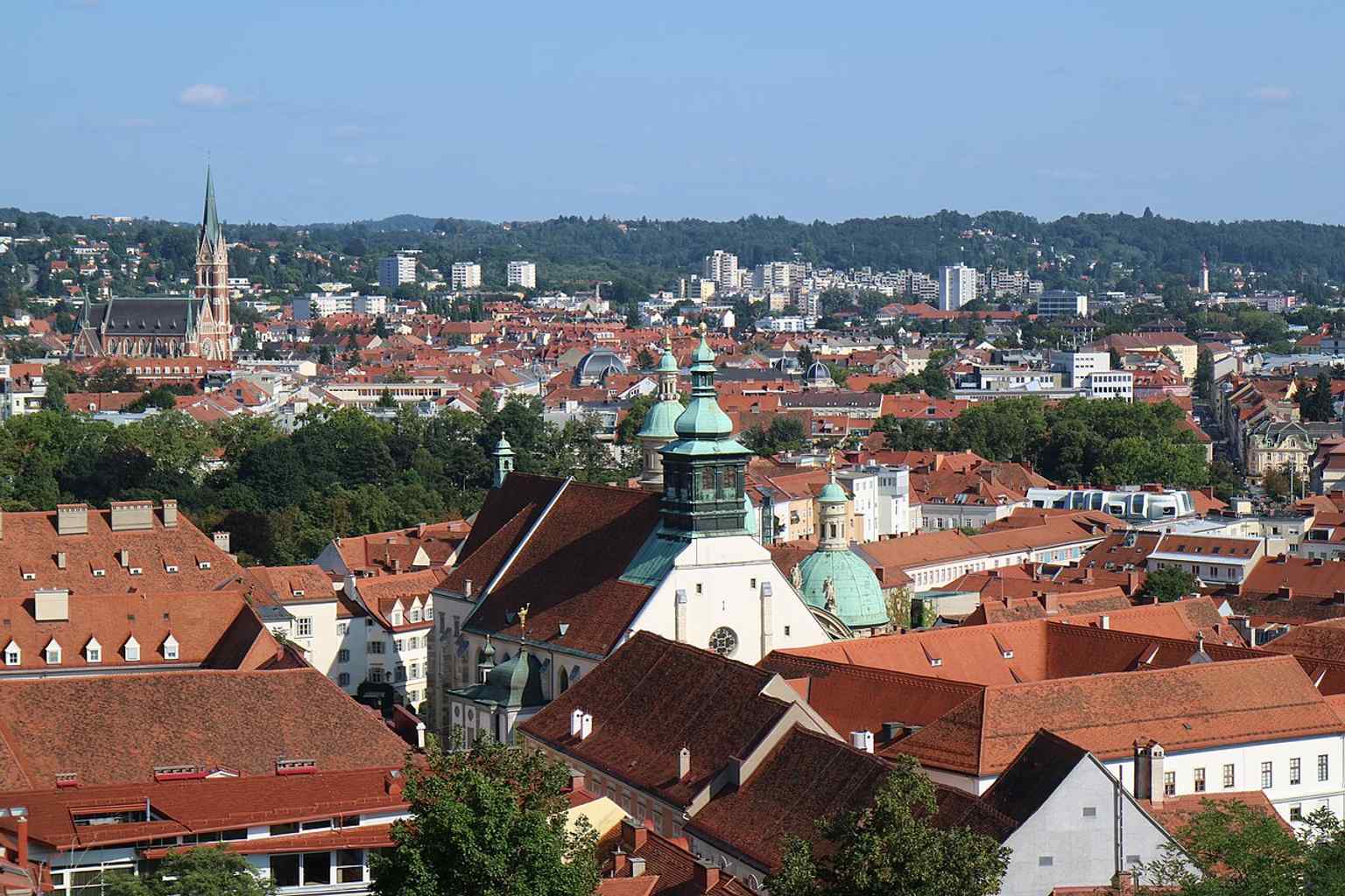 A classic skyline view of Graz’s city crown, with the Cathedral, the Mausoleum, and the Katharinenkirche all visible together.