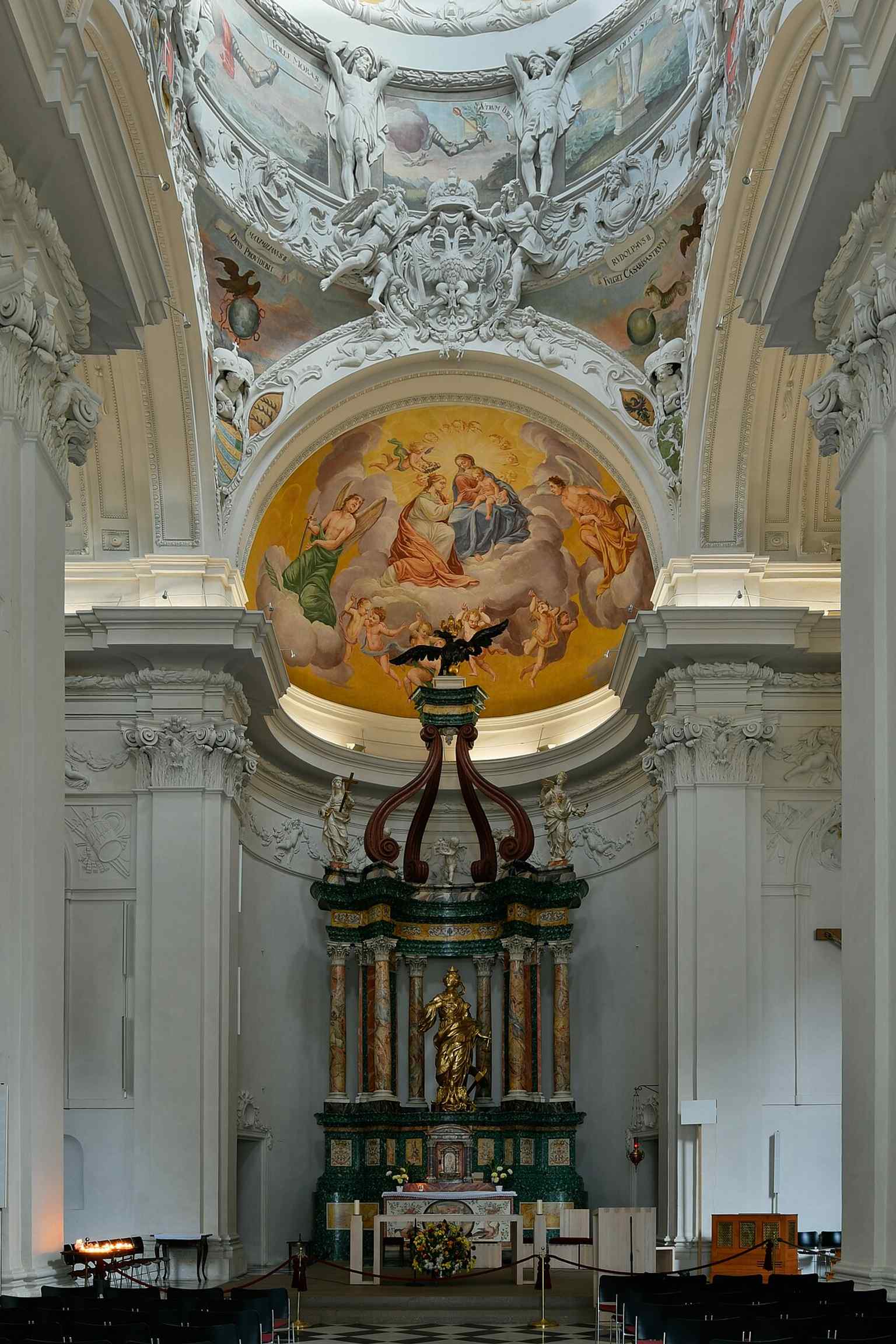 Inside the Katharinenkirche, the richly decorated nave and altar space reflect the Baroque redesign carried out after decades of interruption.
