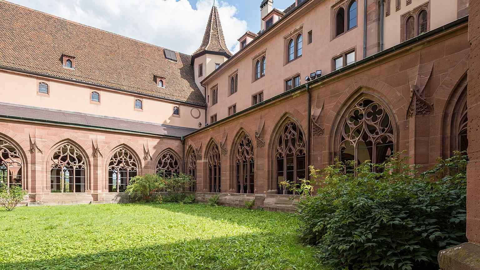 The large cloister with its elegant late-Gothic tracery — among the finest cloisters in Switzerland.