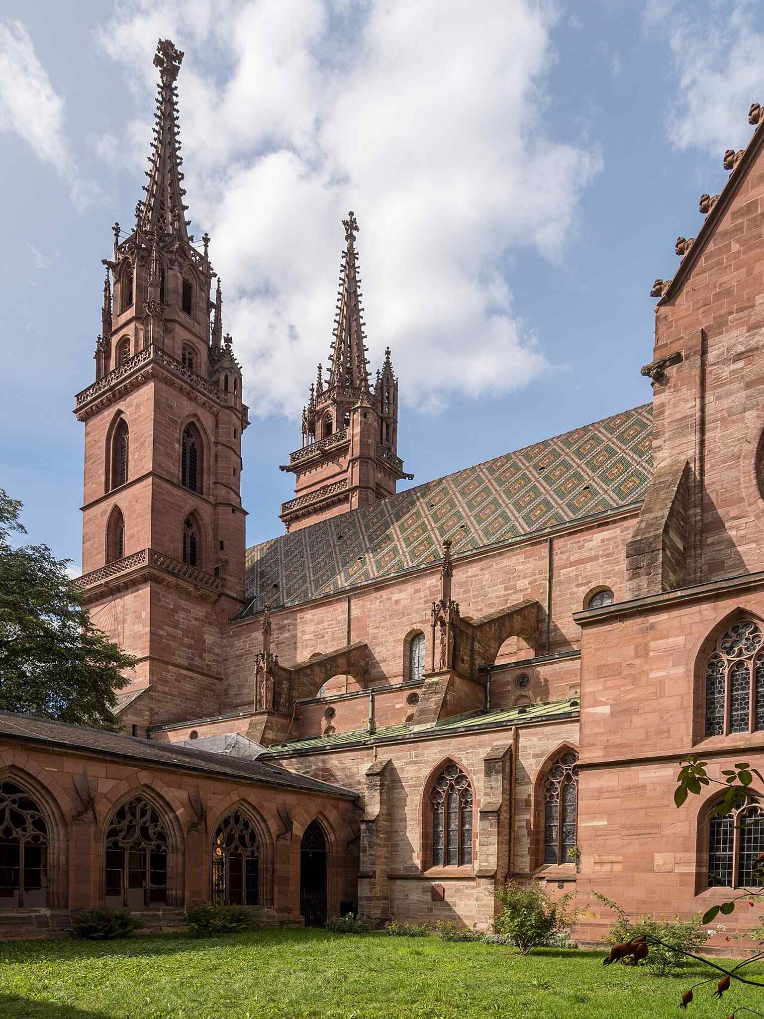 The cloister side looking toward the towers, showing how the Minster’s massing dominates the surrounding monastery buildings.