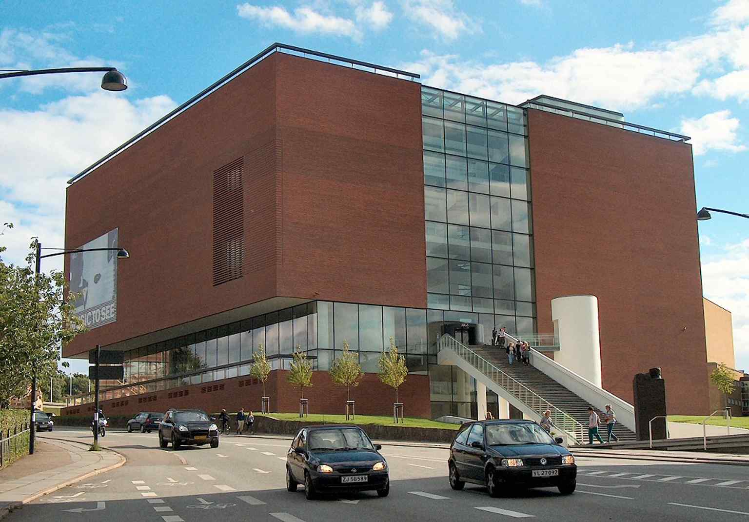 A clear street-level view of ARoS’s cube-like building, useful for introducing the museum’s modern 2004 home on Vester Allé.