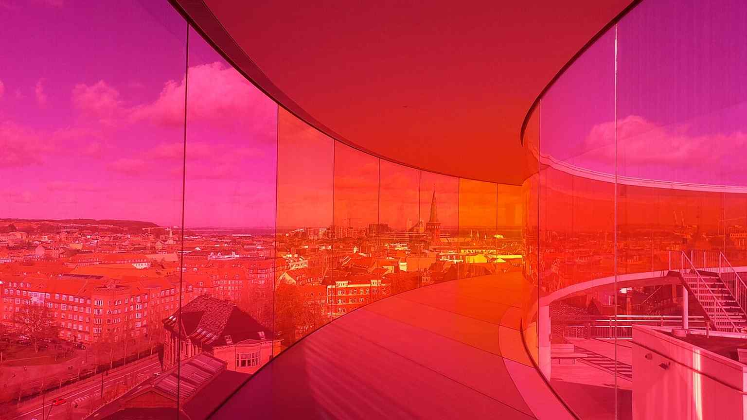A vivid interior view inside Olafur Eliasson’s rainbow walkway, showing the 360-degree city panorama that made the rooftop artwork famous.