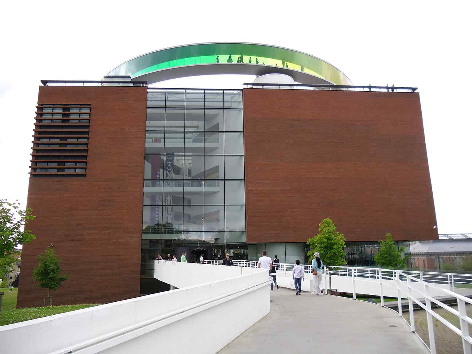 The museum façade with Olafur Eliasson’s rainbow ring on top, showing the iconic combination of ARoS’s architecture and rooftop artwork.