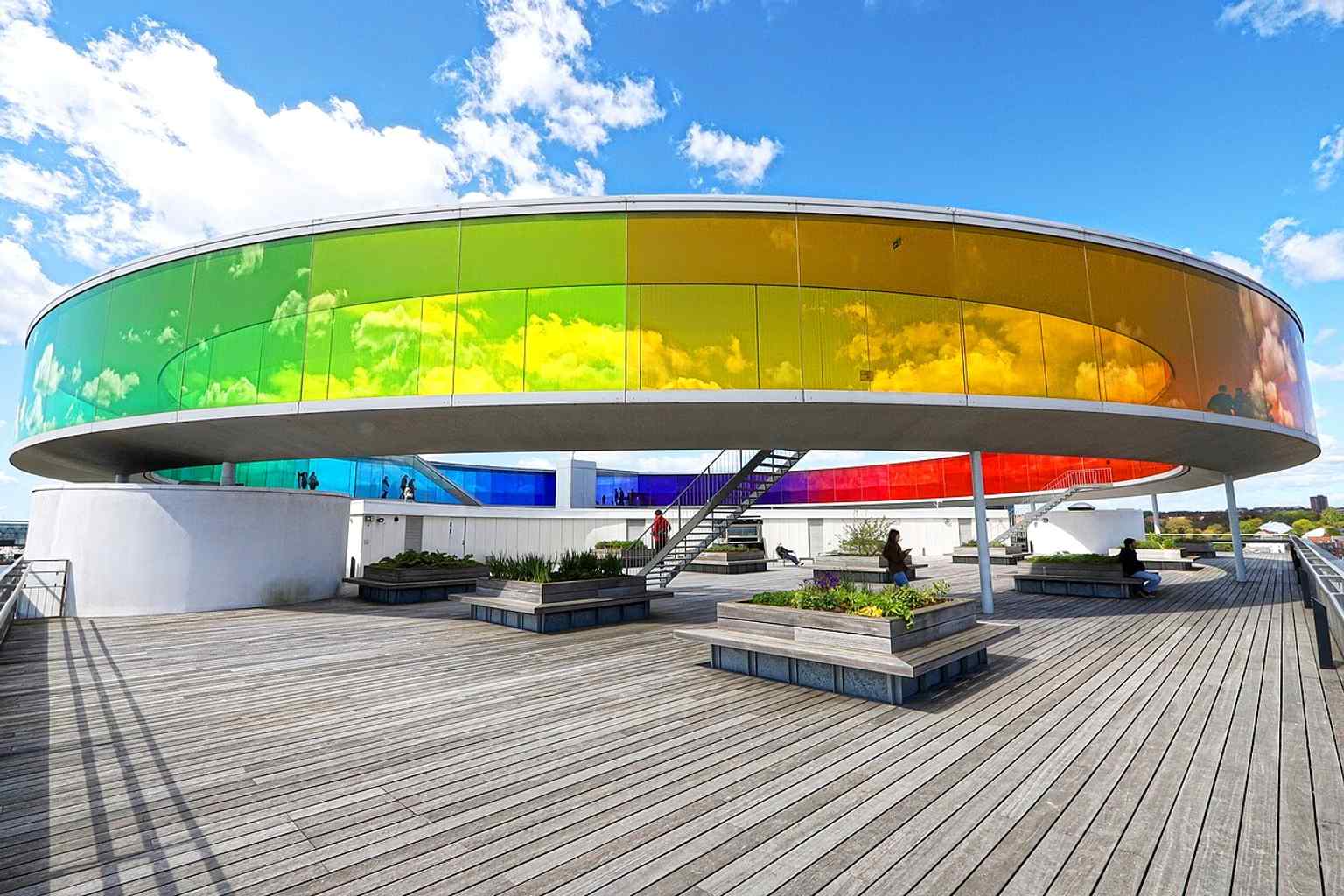 Inside Your Rainbow Panorama, where the colored glass turns the city view into an immersive walk above Aarhus.