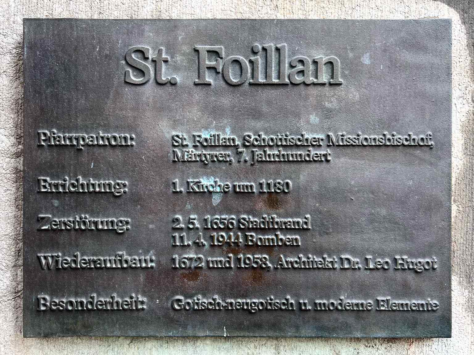 An information board on the church exterior displays key historical dates, including its founding around 1180 as a parish church for Aachen's citizens, distinct from the nearby Dom.