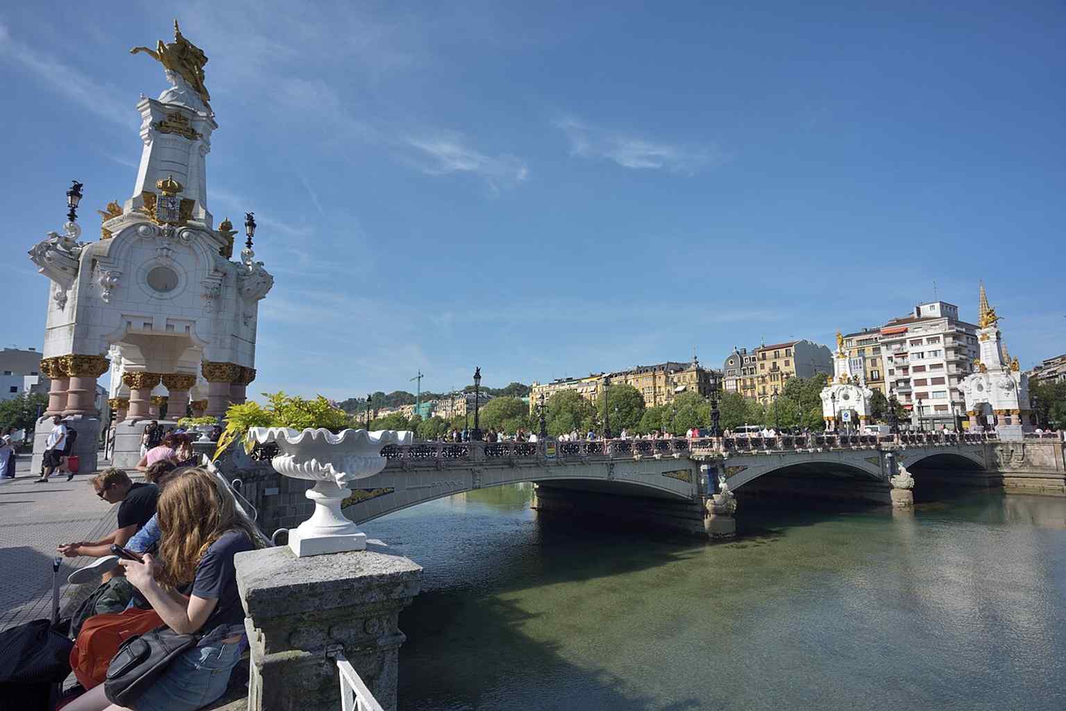 A high-resolution contemporary view of María Cristina Bridge, capturing the restored decorative finish that reflects its Belle Époque ambition.