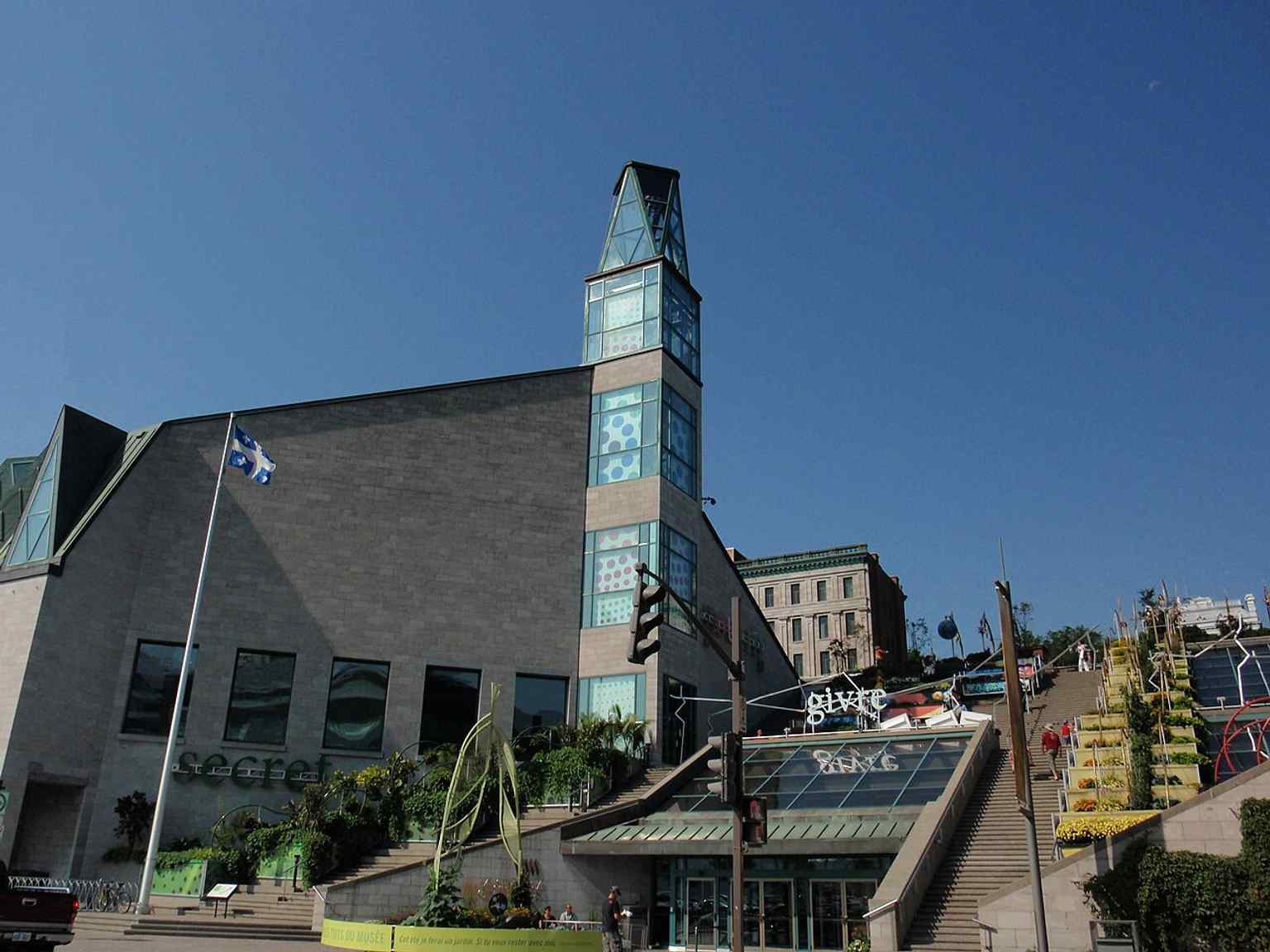 Another strong exterior angle showing the museum on the Saint Lawrence waterfront, tying the building to its setting in Old Québec.