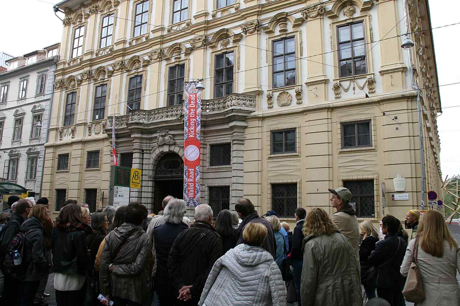 A guided-tour style historical image of the former Palais Attems, fitting the building’s role as a landmark in Graz’s old town.