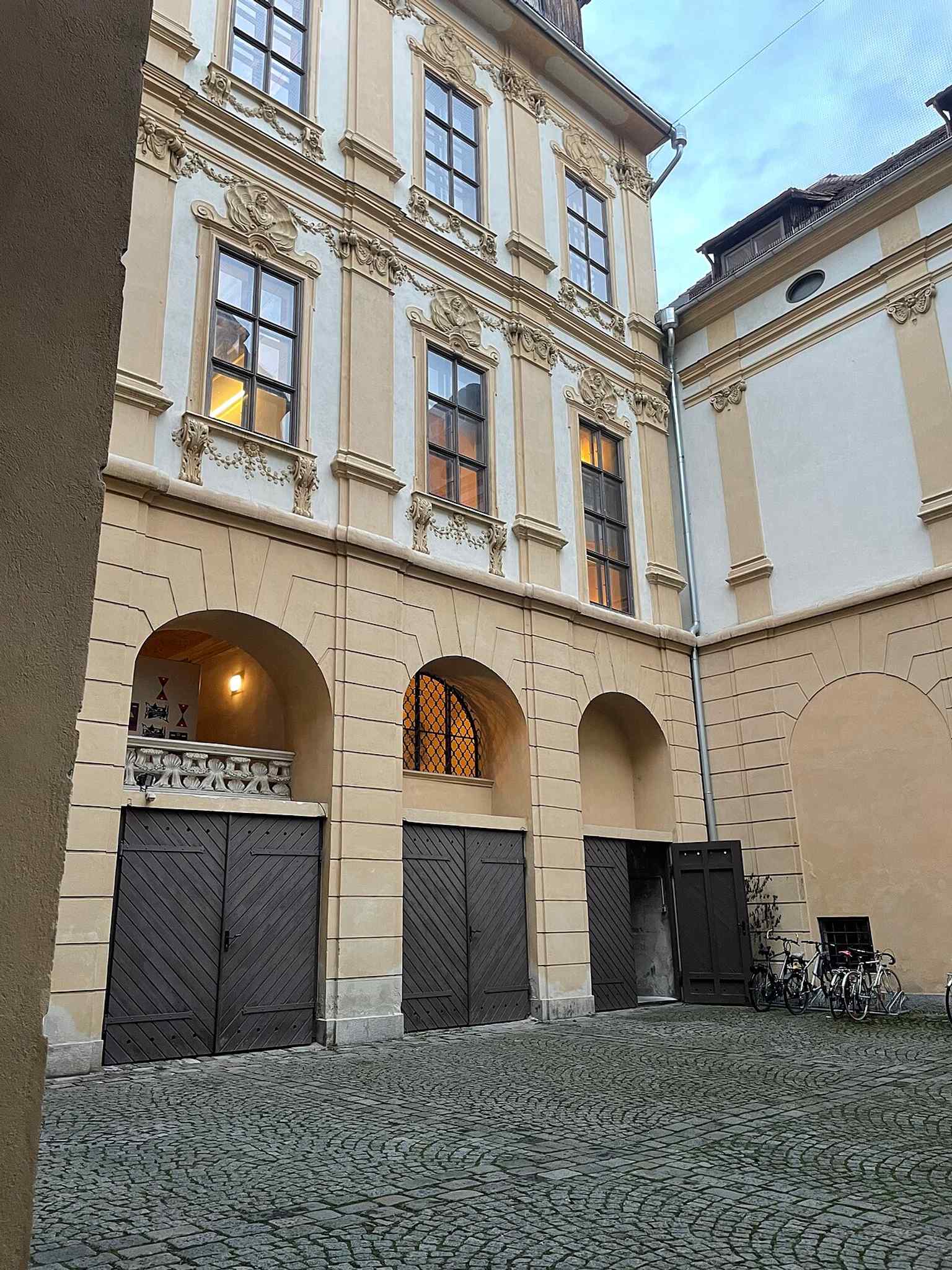 Recent courtyard view showing the palace today and its preserved Baroque enclosure around the interior court.