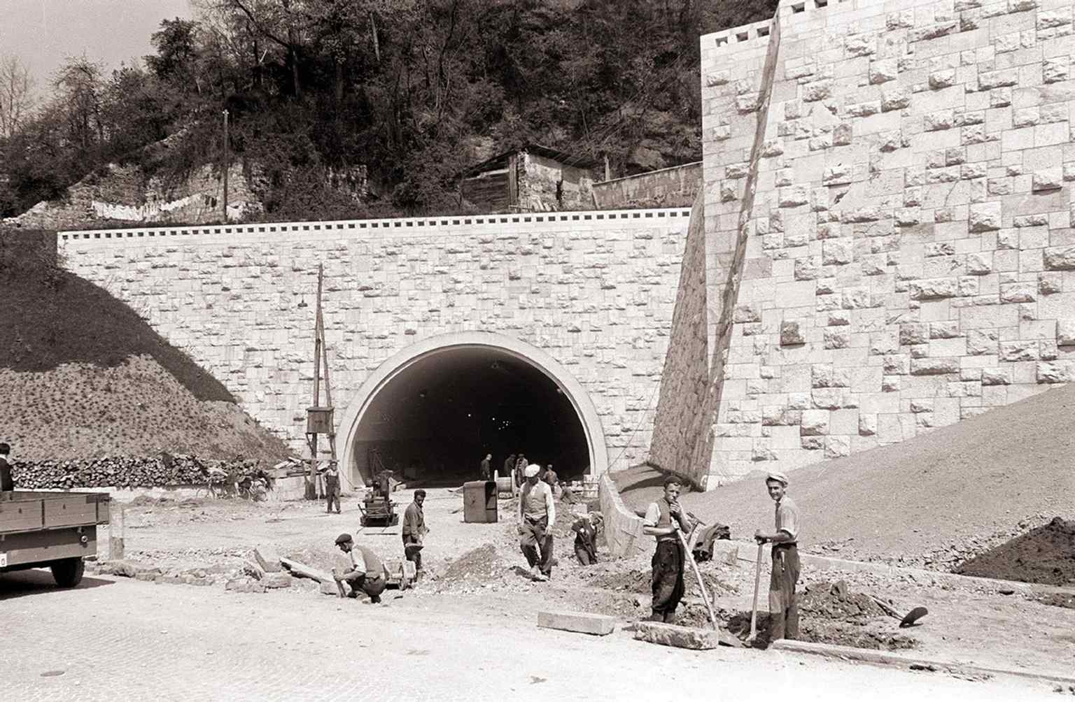 Workers completing construction of the tunnel in 1959. Initial plans date back to the Kingdom of Yugoslavia, and the first few meters dug served as a bomb shelter during WWII.