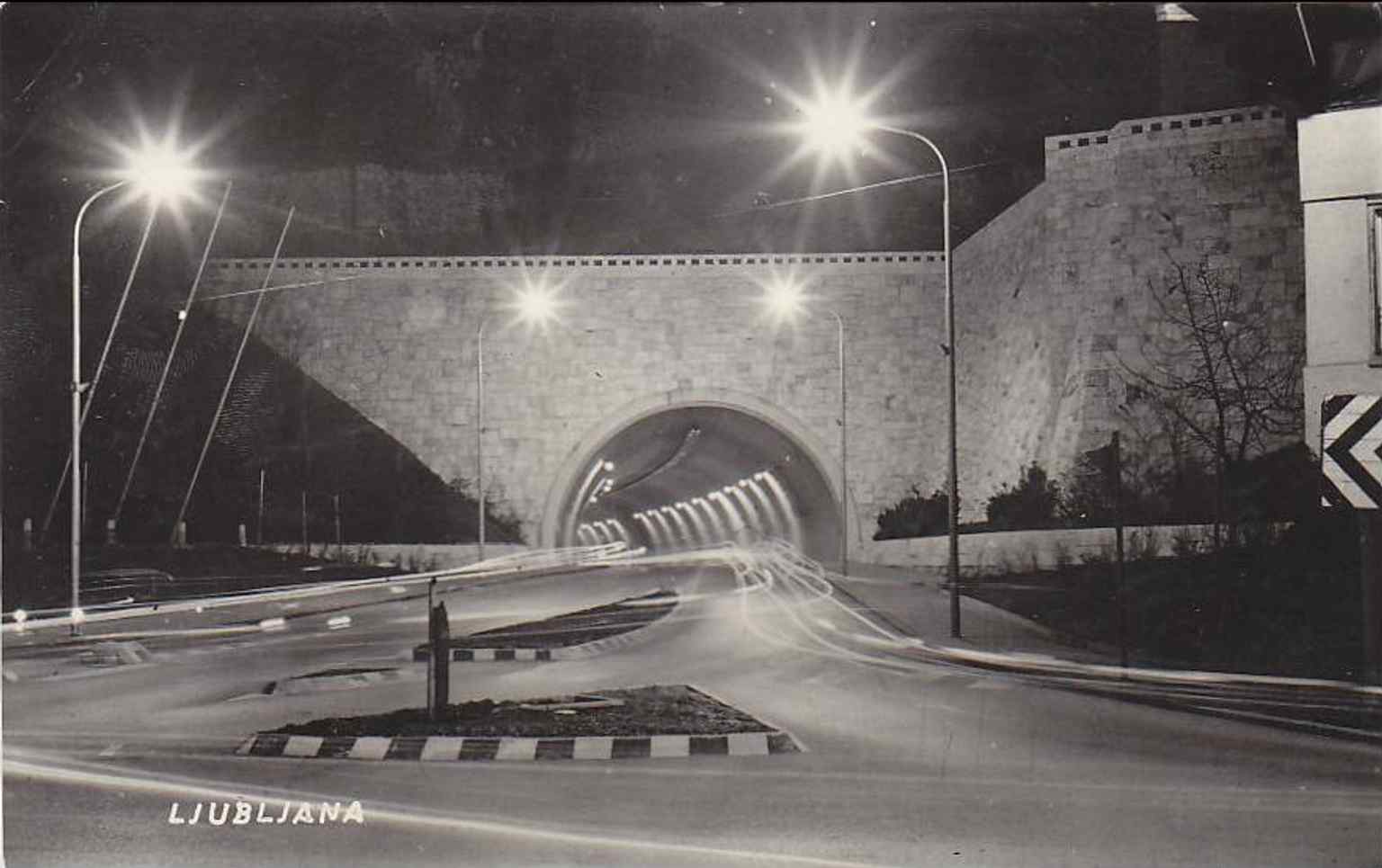 A 1965 postcard showing the tunnel's portal. Its opening in 1959 was a grand event, with Bojan Polak cutting the ribbon as a convoy of cars and motorcycles drove through.