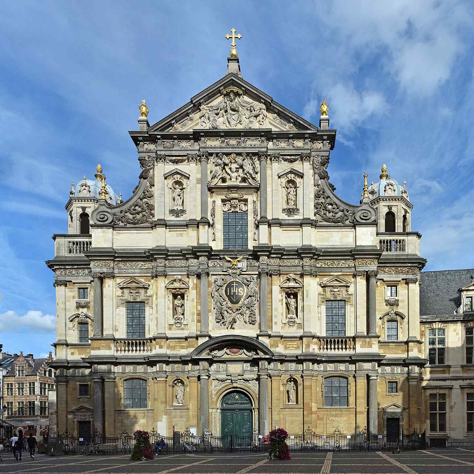 A large, detailed facade shot that captures the church’s imposing scale and ornate Baroque decoration.