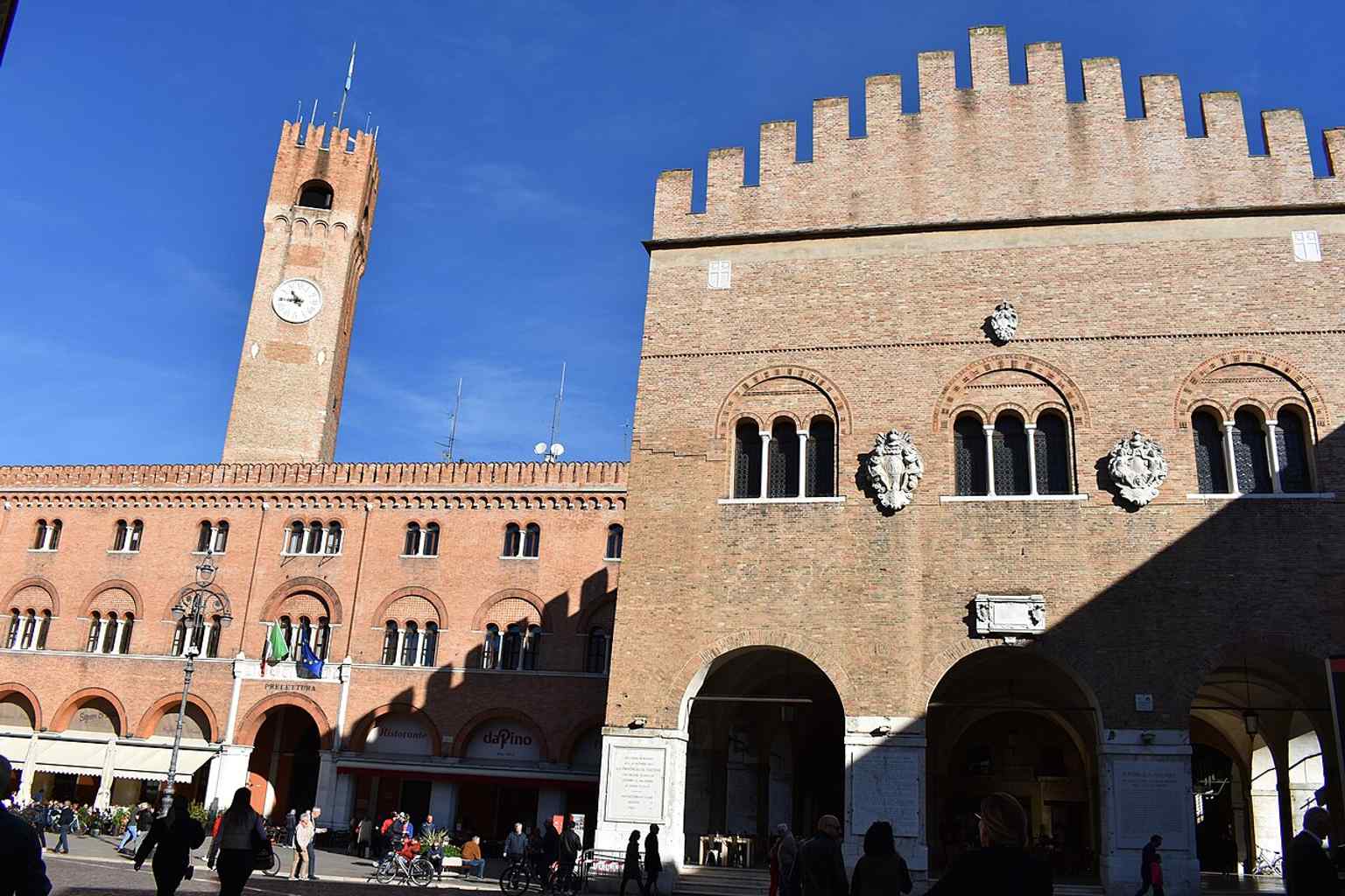 The Loggia dei Trecento in sharp detail — this open ground-floor arcade is one of the square’s defining features and once housed the city’s great council hall above.