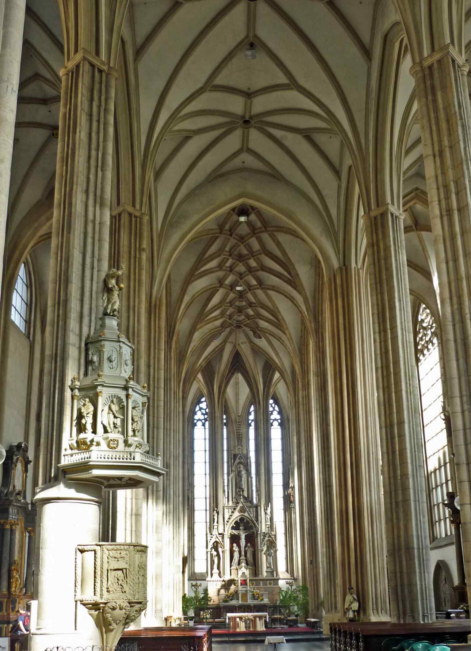 A close interior view from the nave, useful for showing the church’s scale and its richly furnished but restrained Gothic-baroque mix.