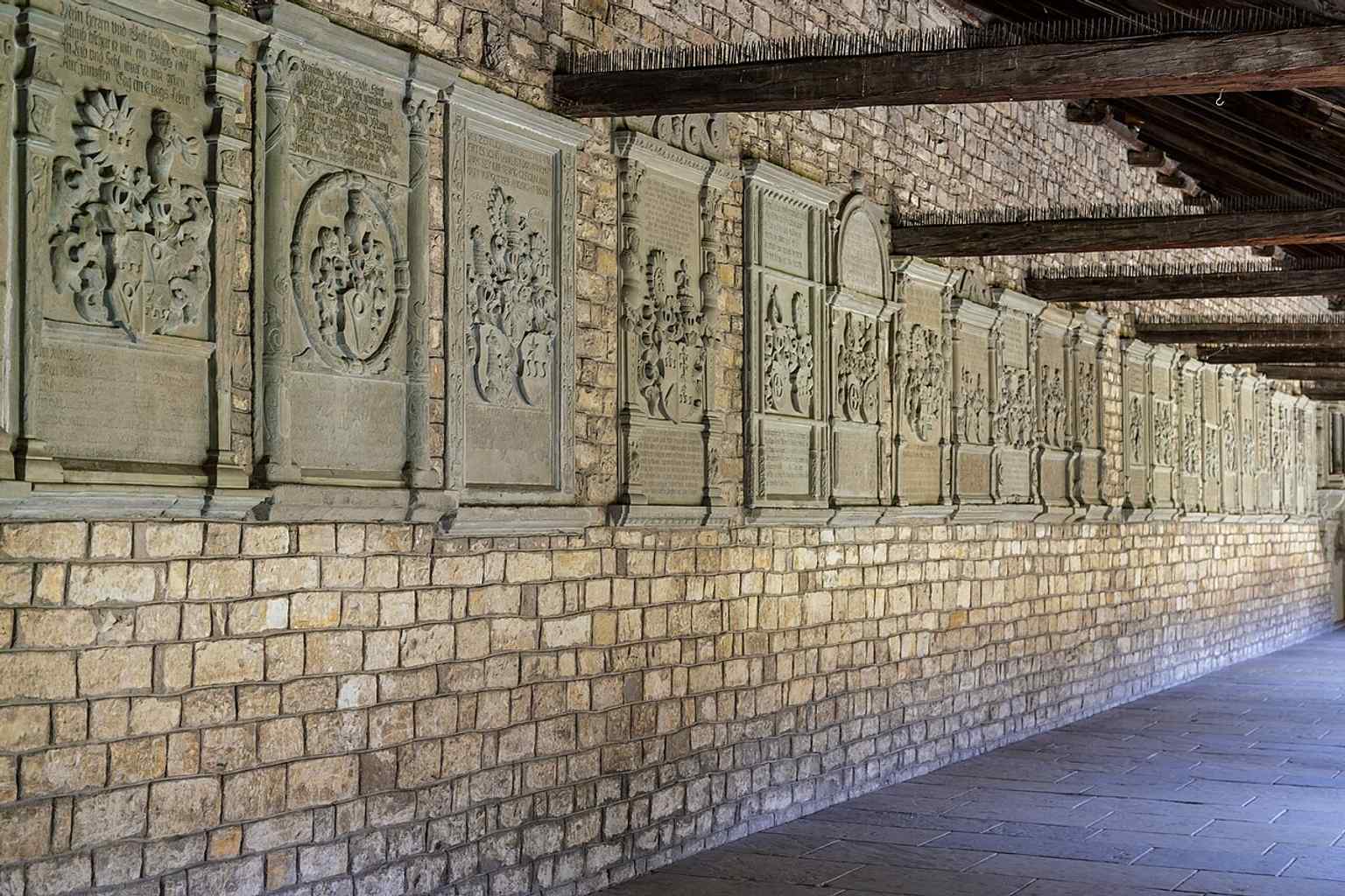 Cloister epitaphs in Allerheiligen, recalling the abbey’s role as the burial place of the Nellenburg founders and later abbots.