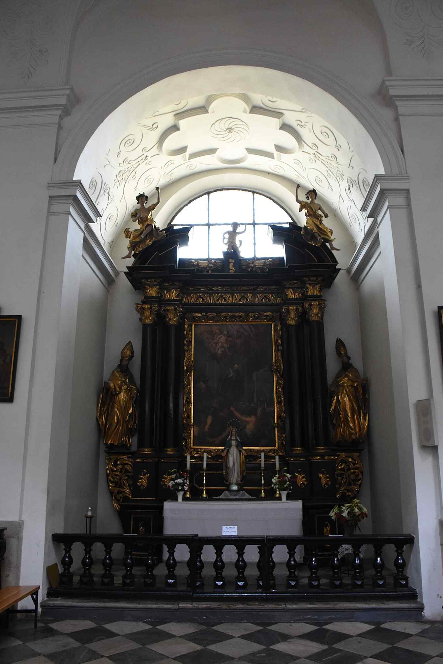 The altar of Saint Thomas of Villanova, adding variety among the church’s many devotional altars.