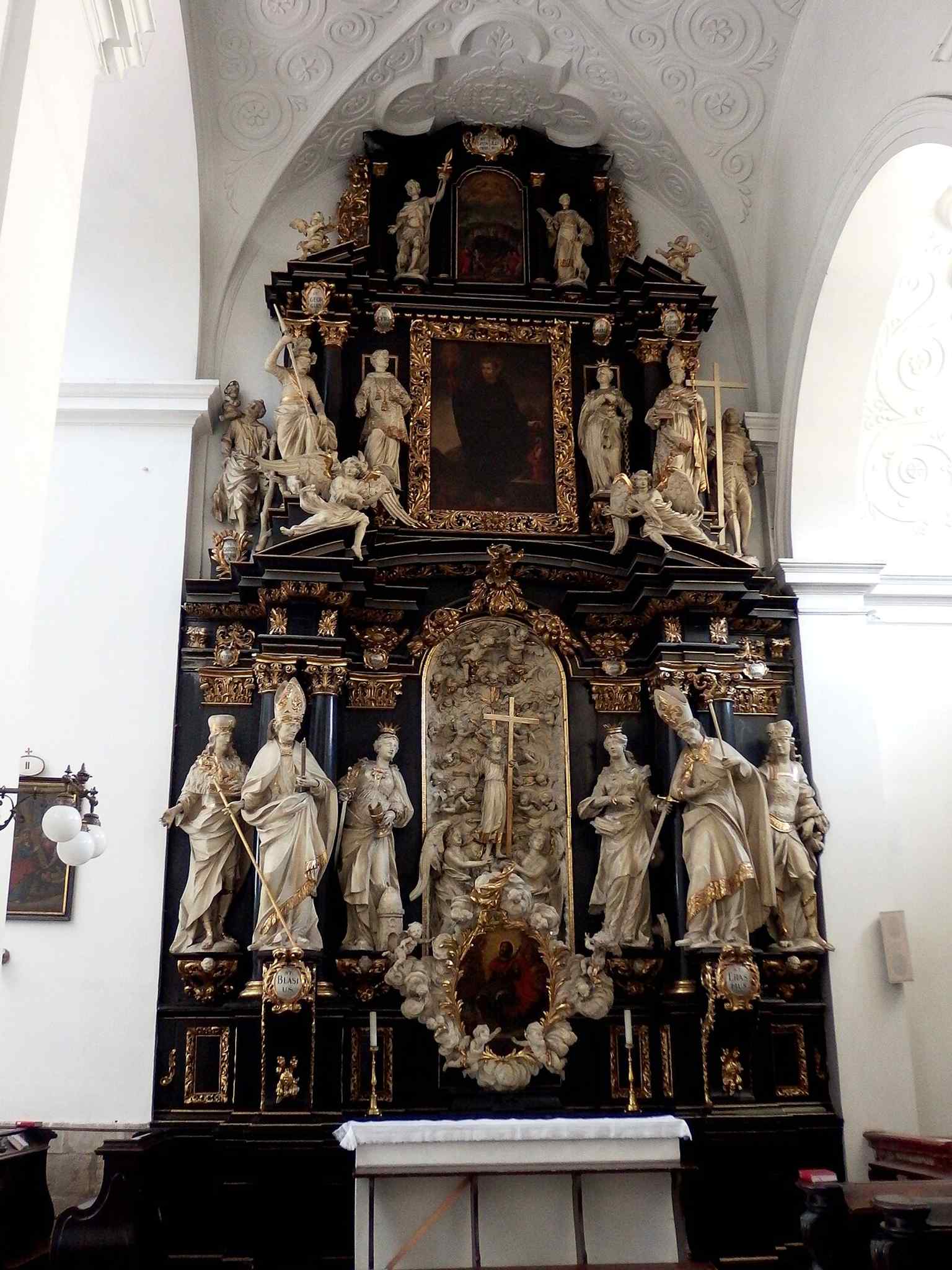 The altar of the Fourteen Holy Helpers, showing the dense devotional program inside the church.