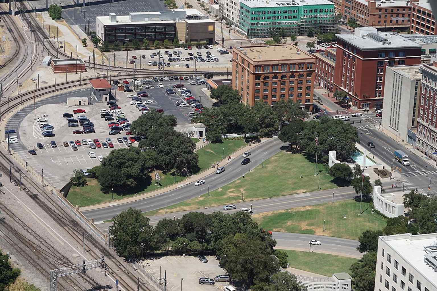 From Reunion Tower, you can see how Dealey Plaza sits beside downtown Dallas and the rail corridor that shaped its design.