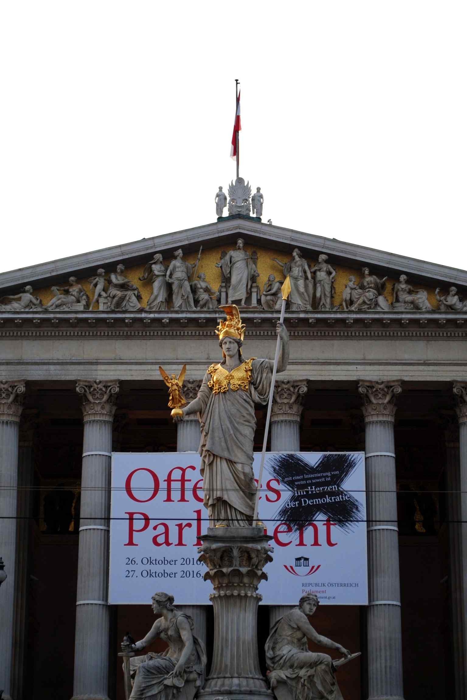 The architect Theophil Hansen designed the building holistically, with each exterior element, including statuary and columns, harmonizing in its Greek Revival style.
