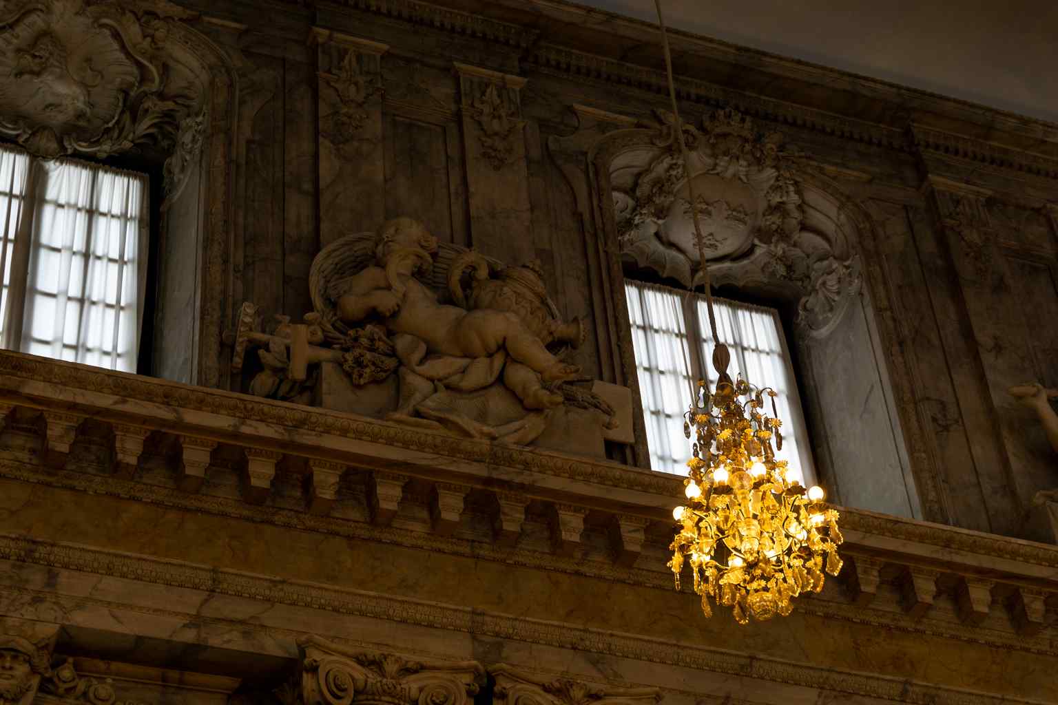 The grand Hall of State, a two-story room introduced for the Riksdag of 1755 and designed by Carl Hårleman, notably houses the Silver Throne of Queen Christina.