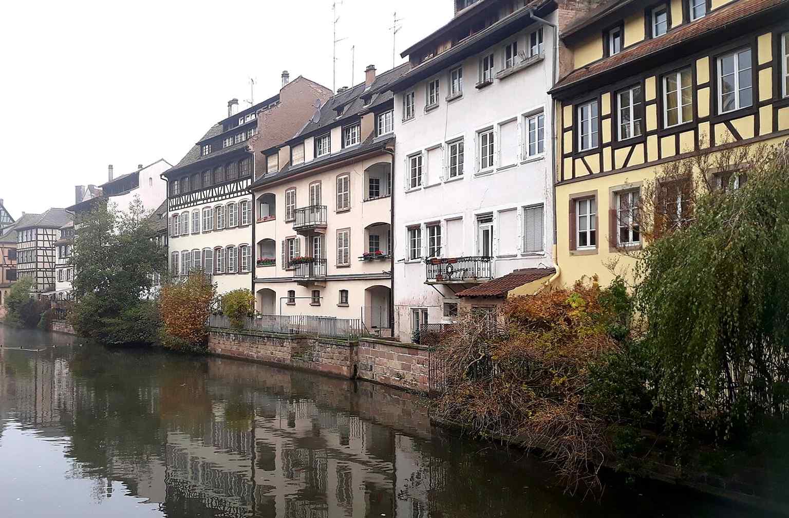 A classic view of timber-framed houses from the Pont du Faisan, echoing the half-timbered façades that made the quarter famous.