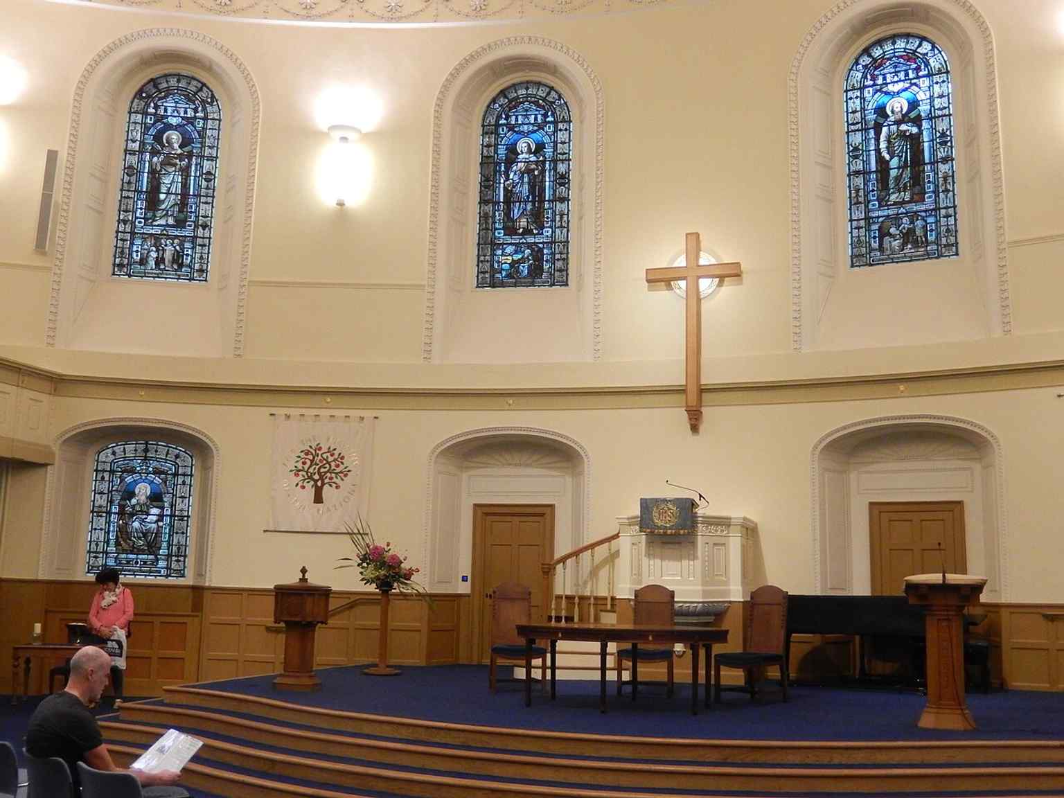 A wide interior view of the church, where the many windows and cornerless ellipse create the bright, famously clear acoustics.