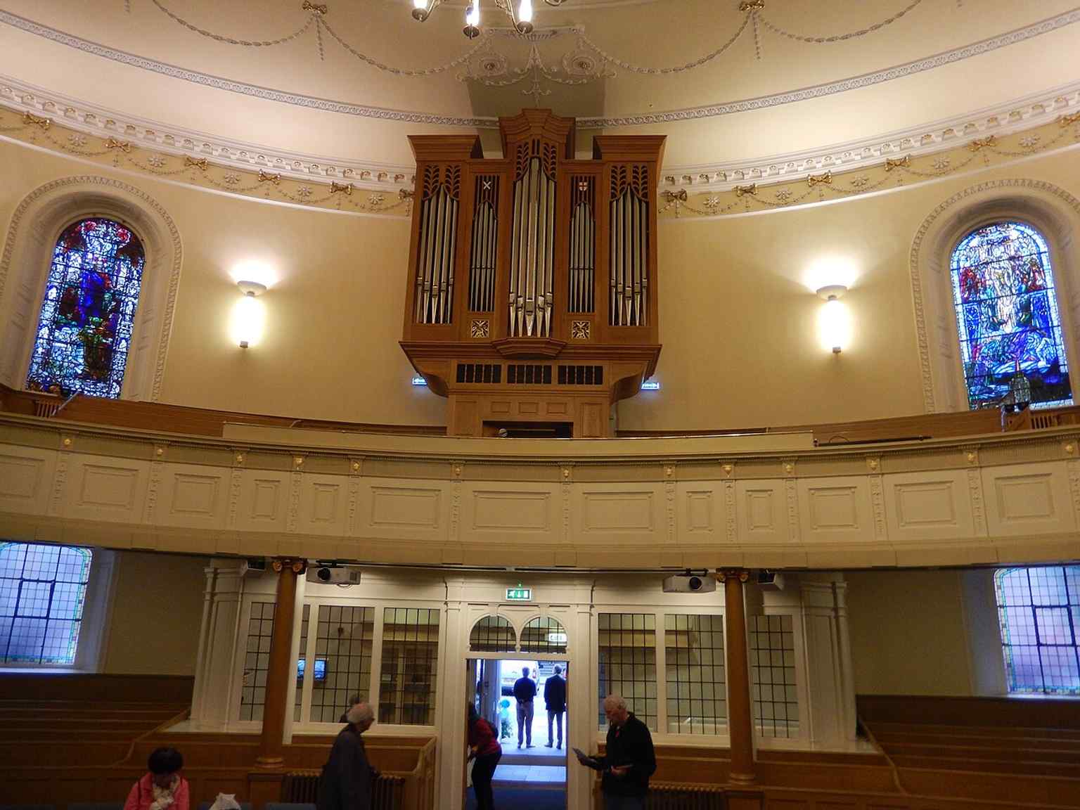 A rear interior view that helps show the church’s broad ellipse and the layered Georgian-to-modern use of the sanctuary.