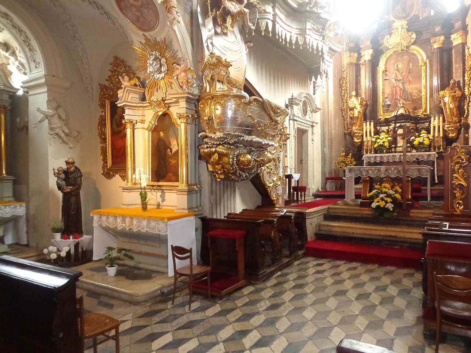 This interior view helps tell the story of the church as a preserved monastic sanctuary, where medieval structure and later liturgy coexist.