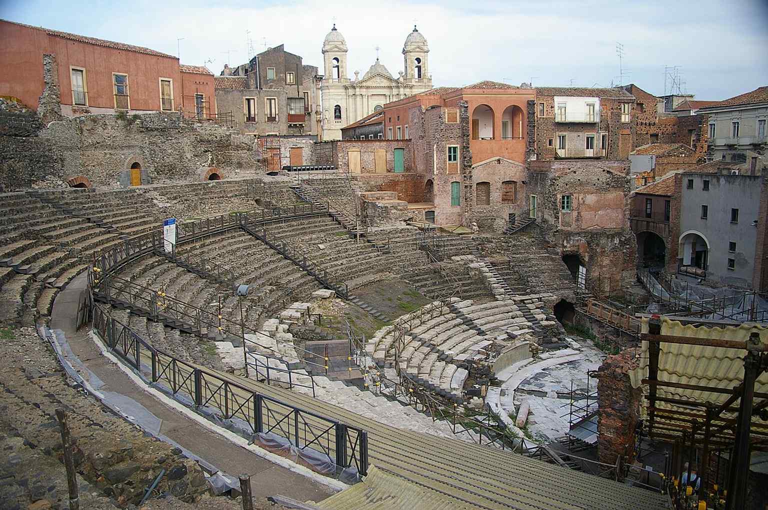 The ruined Greek-Roman Theatre of Catania, where Roman rebuilding in the 2nd century turned an older Greek site into the monument still visible today.
