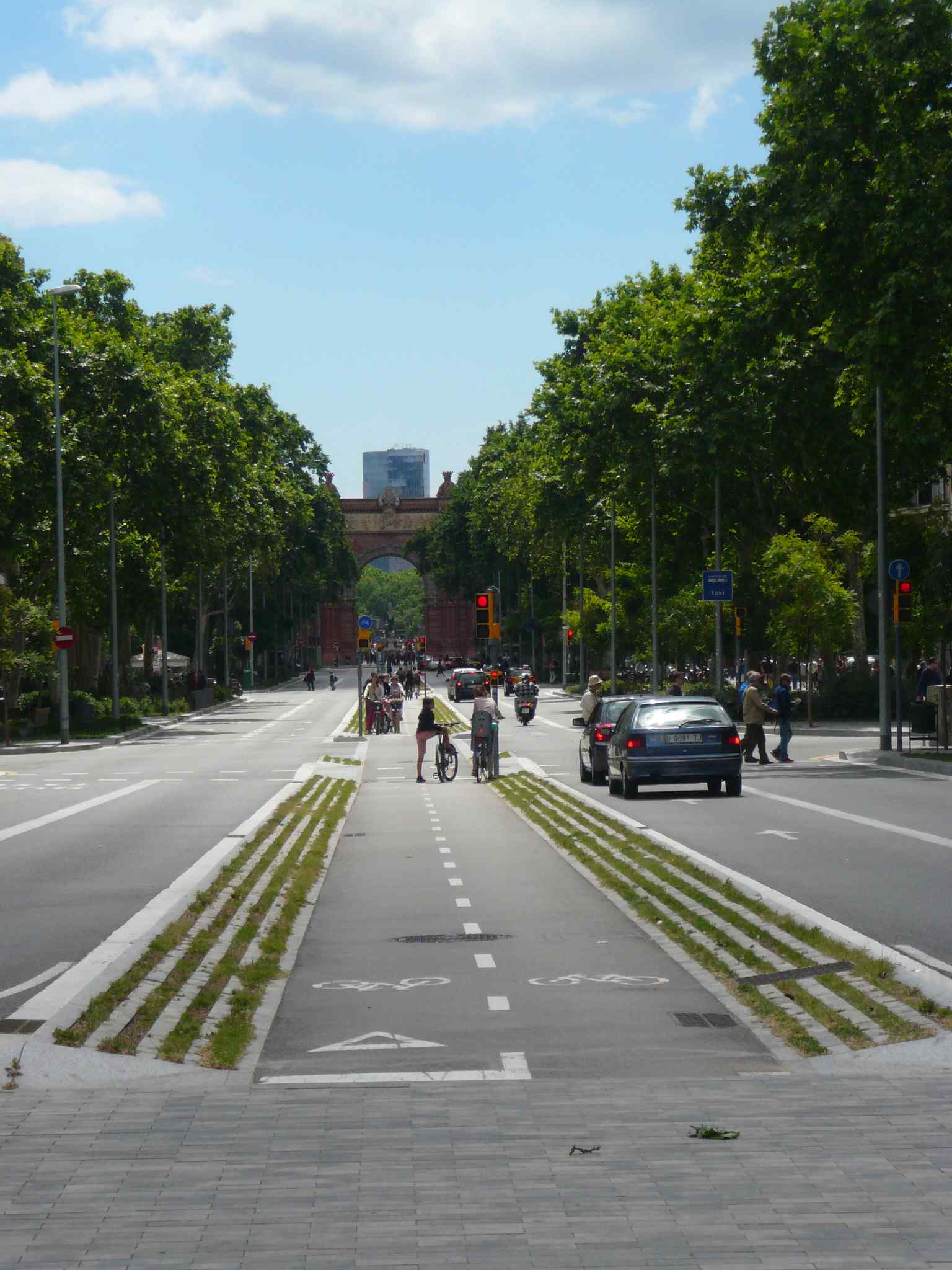 A stunning overview of the Arc de Triomf viewed from the bustling Plaça de Tetuan, showcasing its grand scale within the modern city (2013).