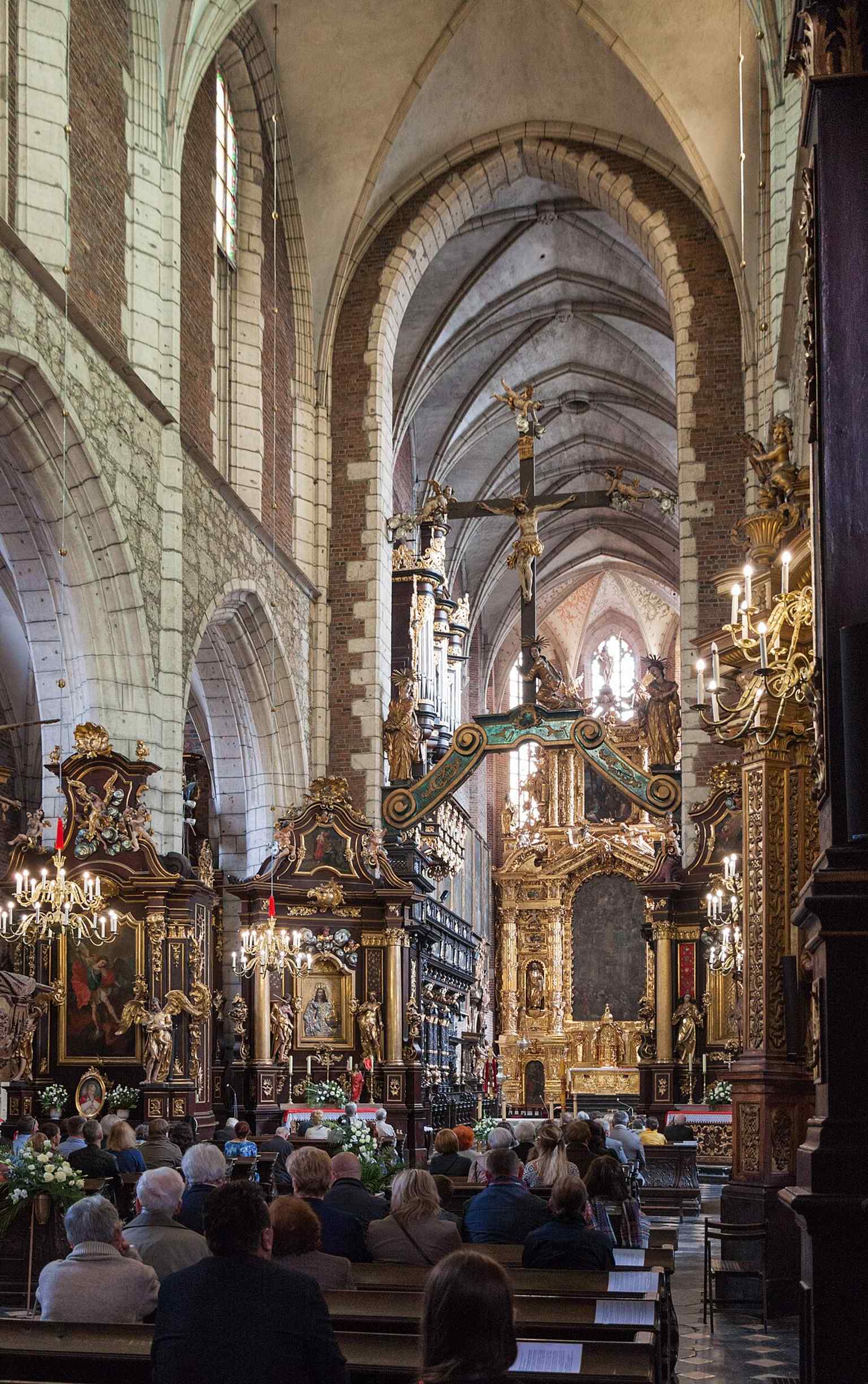 Another interior angle showing the layered church space where monks once lived and worshipped beside the basilica.