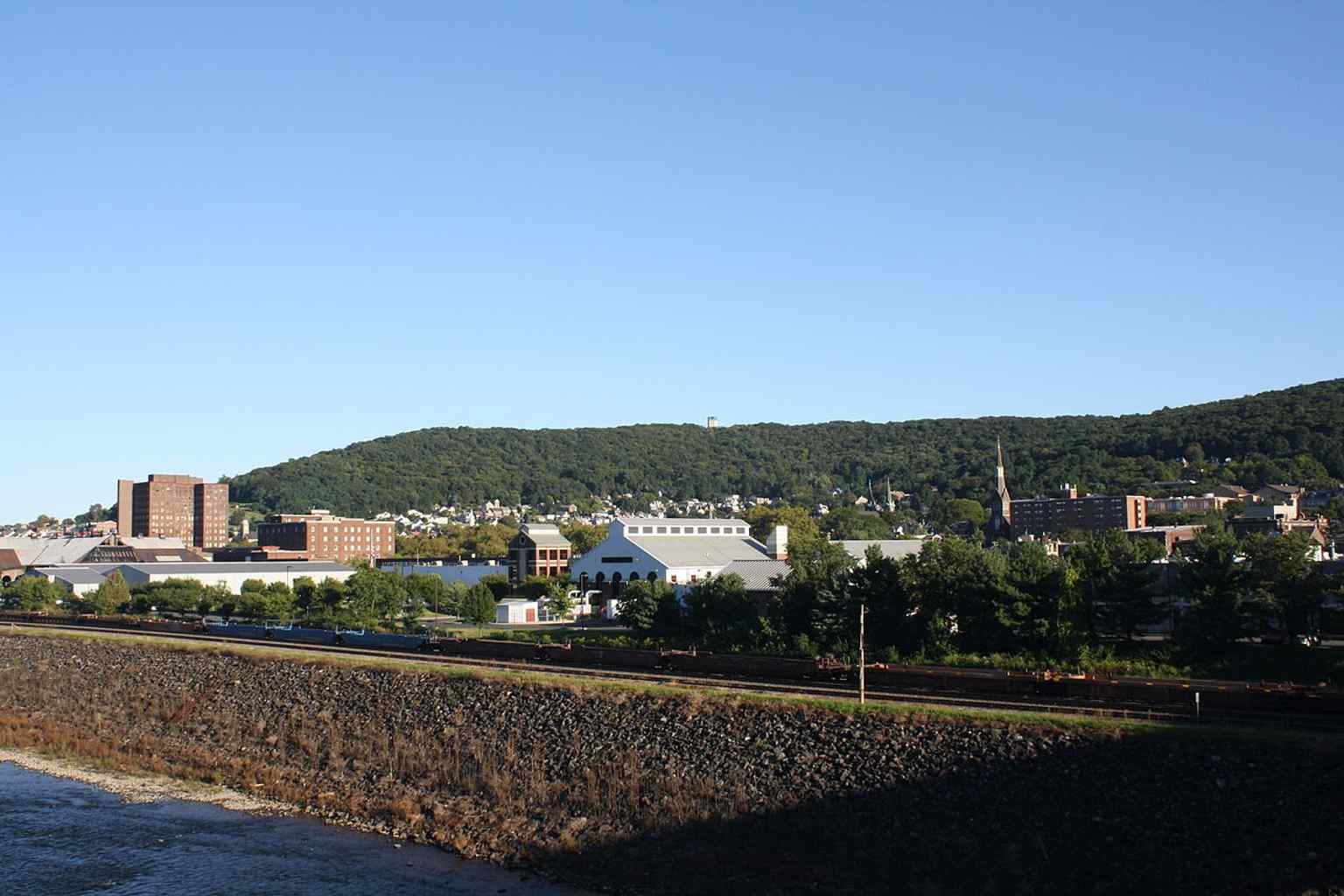 A sweeping view over South Bethlehem and the Lehigh River, showing the dense historic downtown fabric that earned the district National Register recognition in 2005.