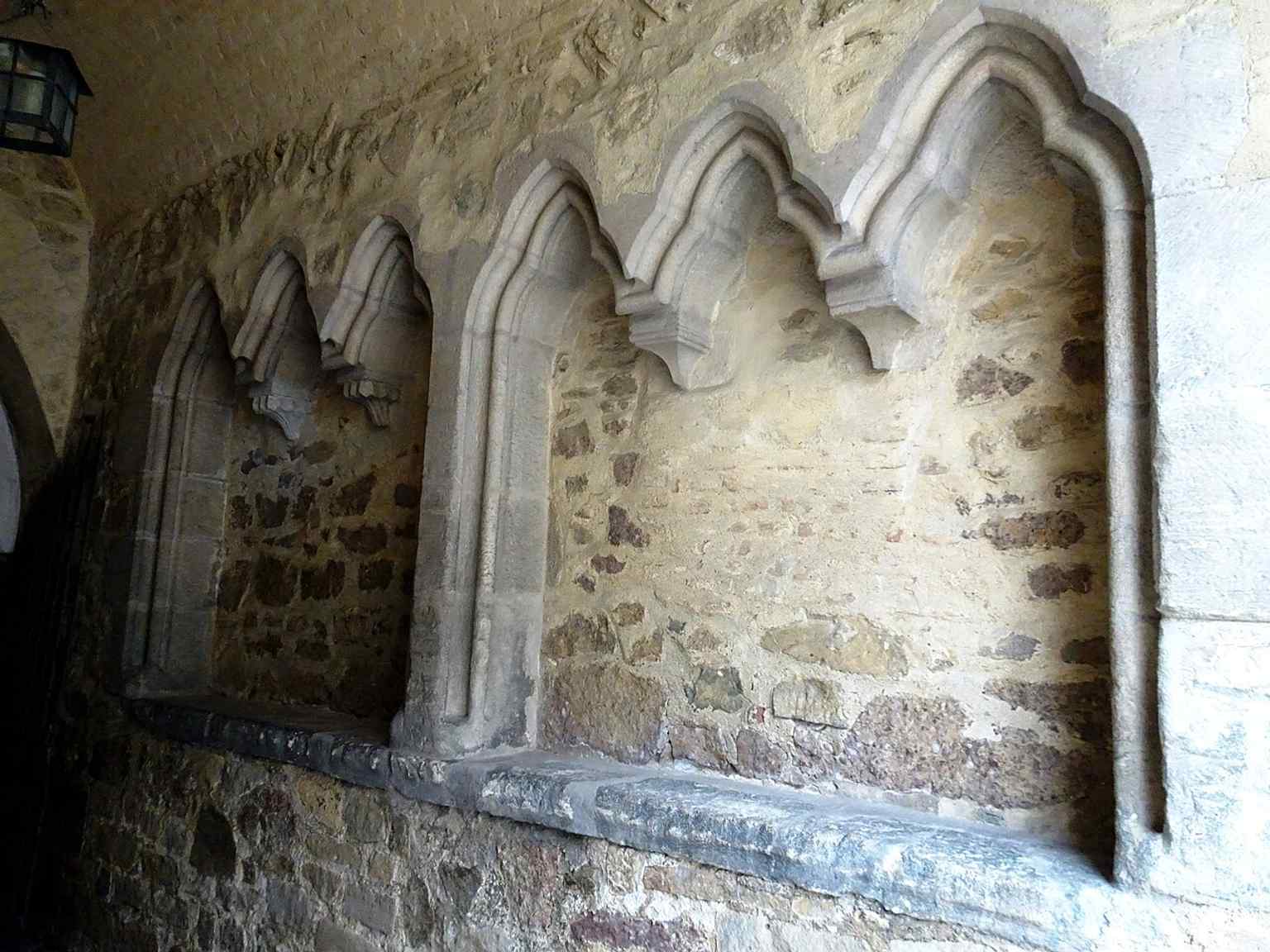 A preserved stone seat in the castle interior, one of the smaller details that help bring the historic fortress spaces to life.