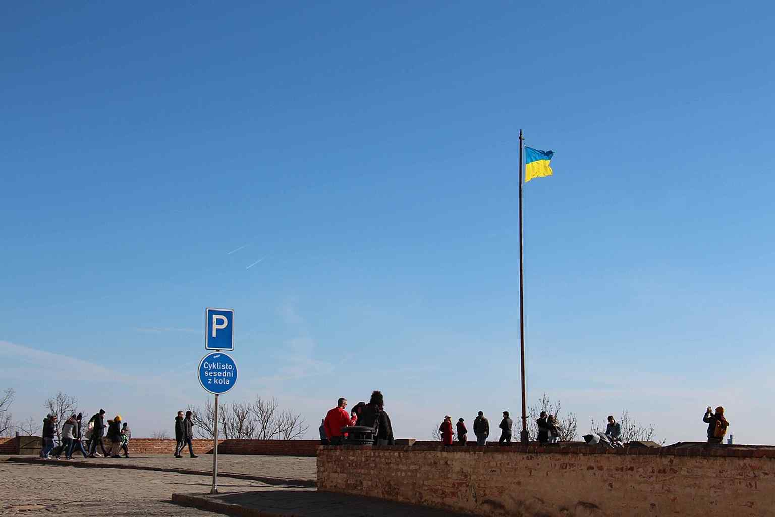 Špilberk as a civic symbol today, with the Ukrainian flag showing the fortress still appears in contemporary public life.