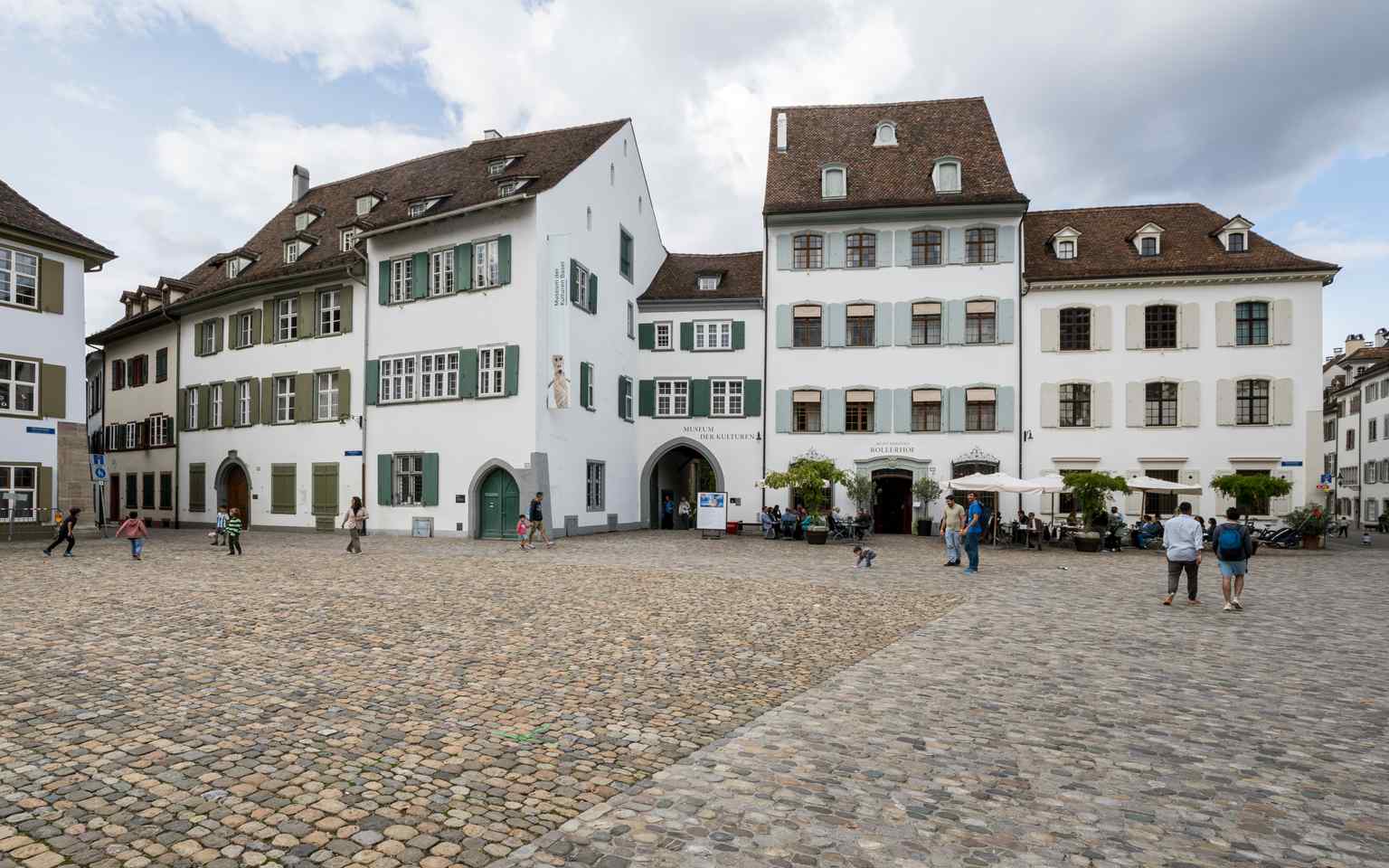 The grand northwest side of Münsterplatz, showcasing the historic architecture and the unique paved ground (2023).
