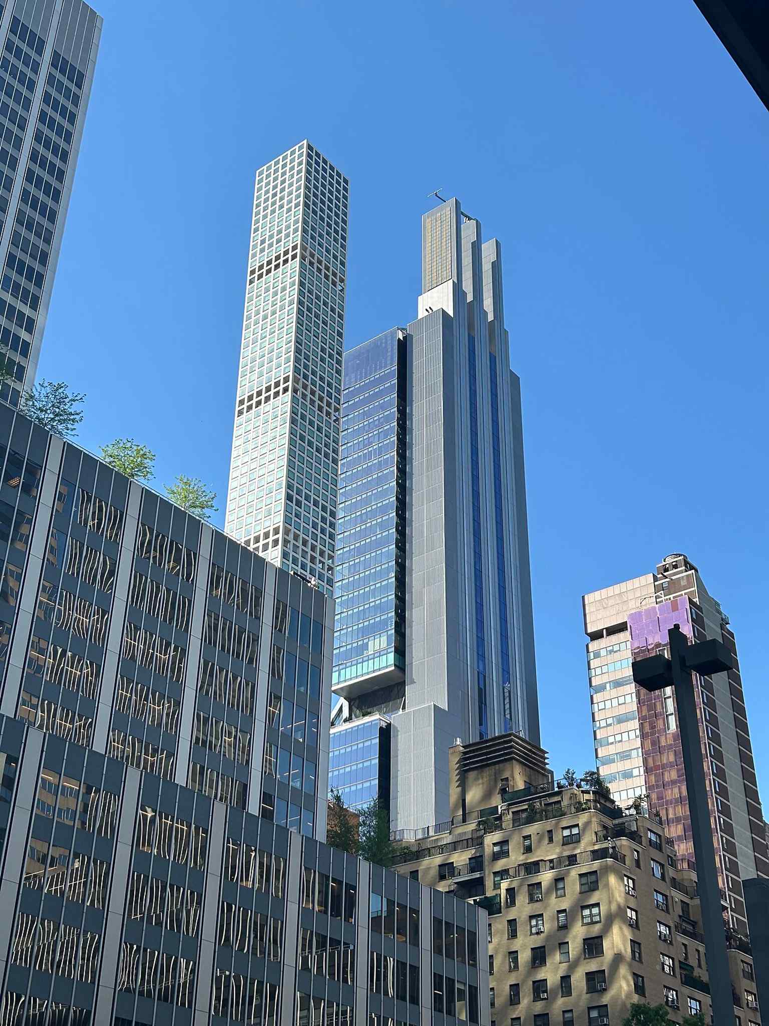 A low street-level angle that emphasizes the building’s extreme slenderness and its dramatic rise over Park Avenue.