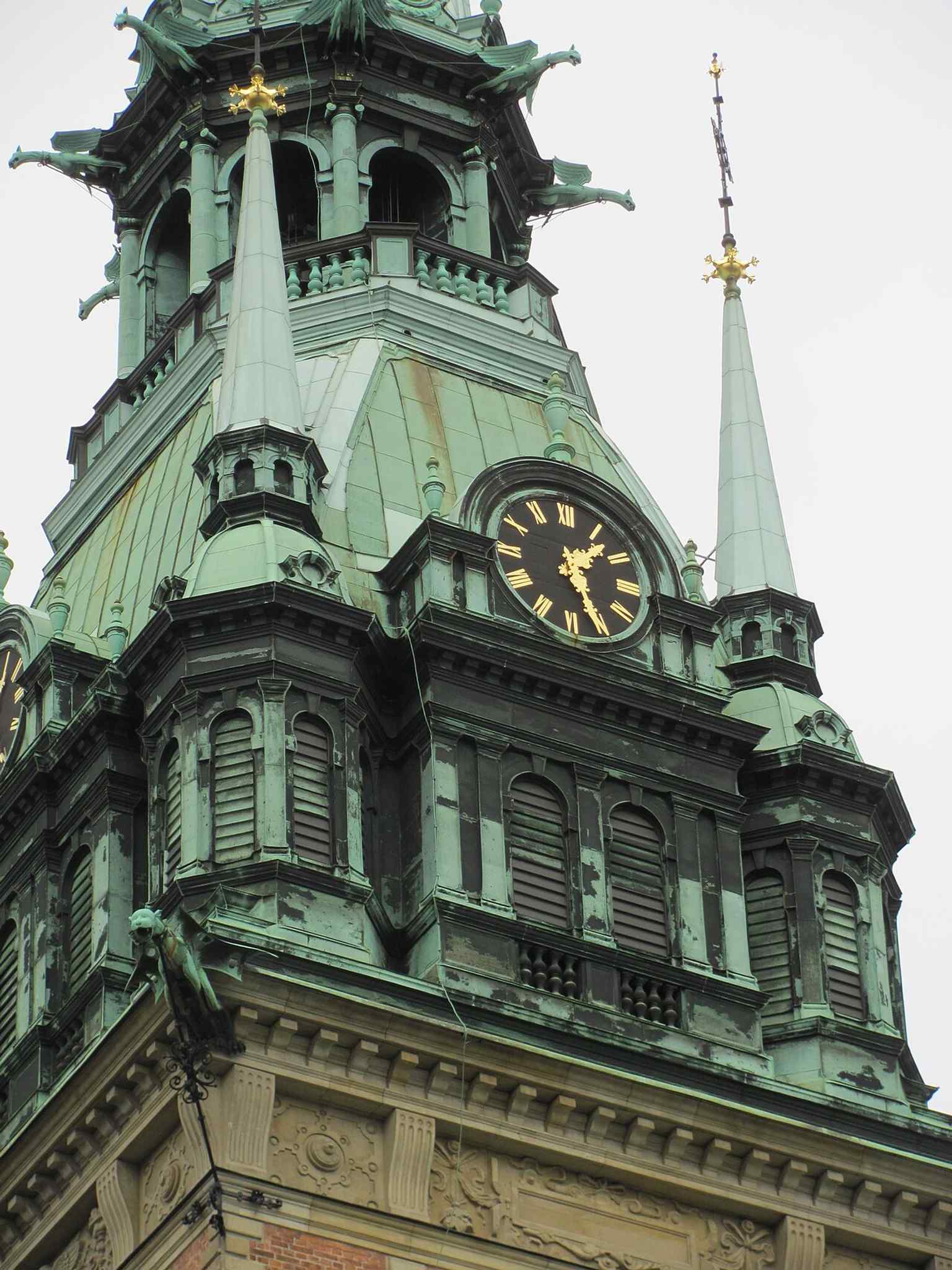 A close view of the clock face on the tower, tied to the church’s famous bells and the daily chimes heard across Gamla stan.