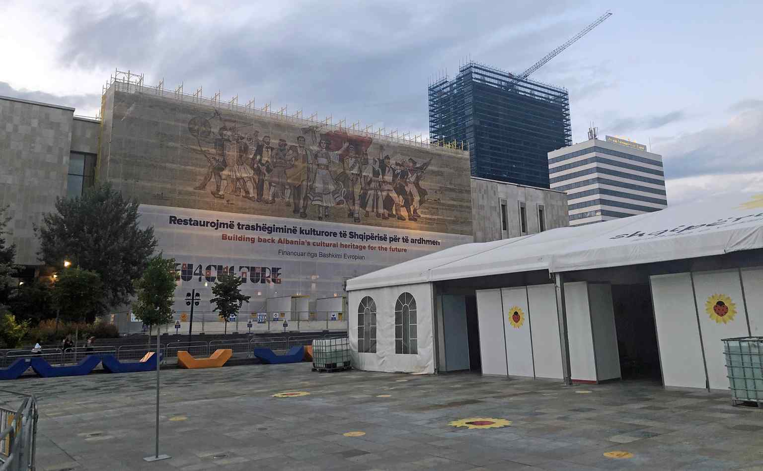The grand mosaic on the National Historical Museum's facade, seen here under restoration, depicts key moments from Albania's history.