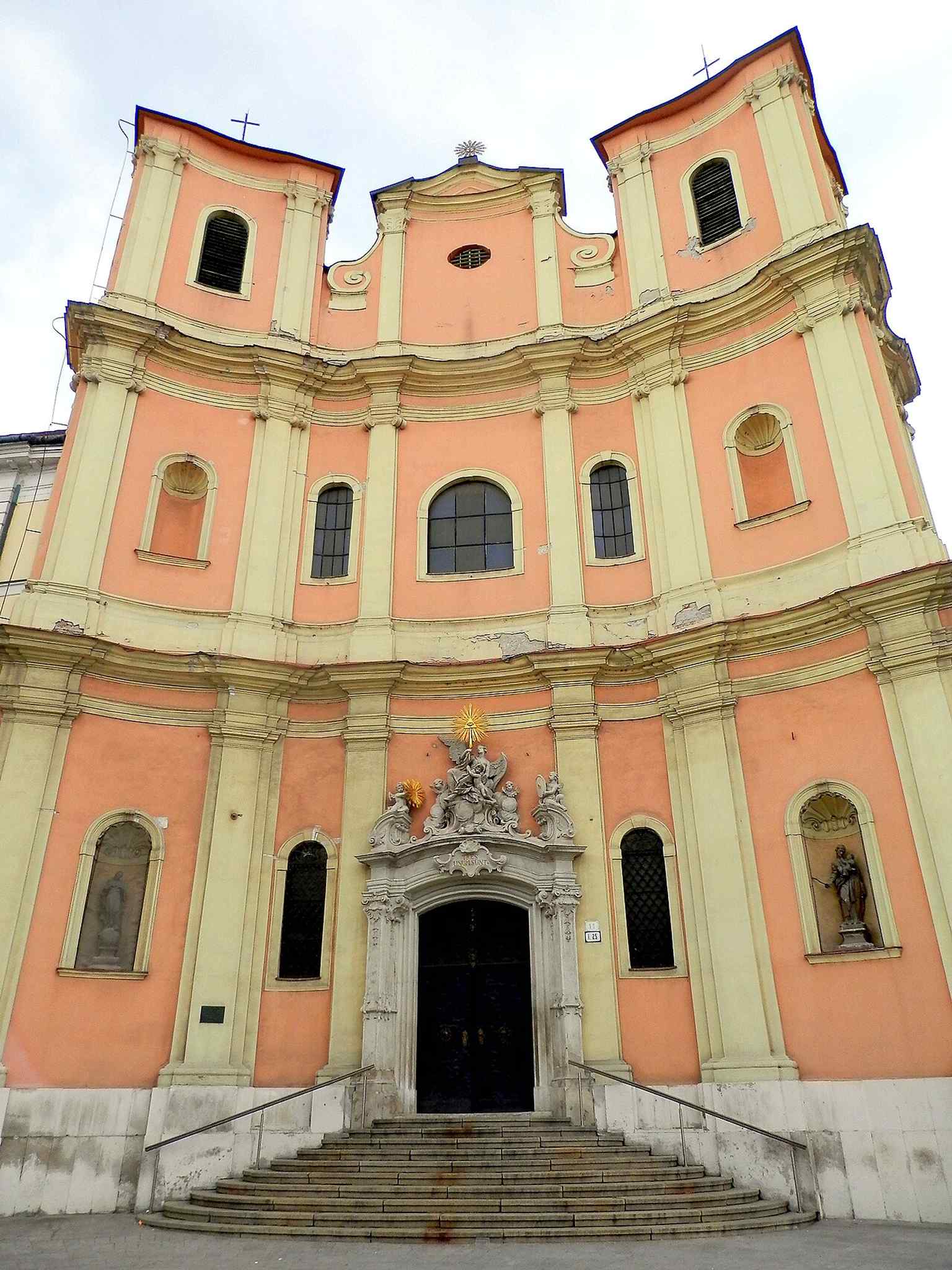 A broader view of the church façade, useful for appreciating its symmetrical front and restrained Baroque decoration.
